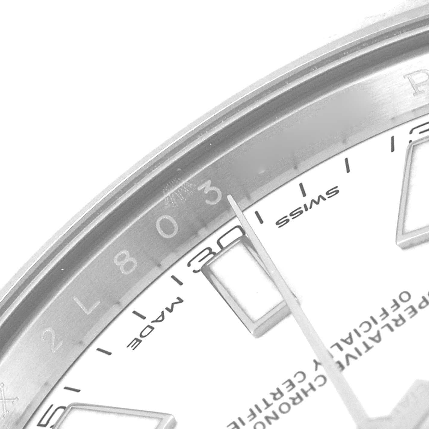 This close-up image shows part of the dial and bezel of a Rolex Datejust 41 116334 Men's Stainless Steel White Dial 116334 Men's Stainless Steel White Dial, focusing on the hour markers and the "Swiss Made" text.