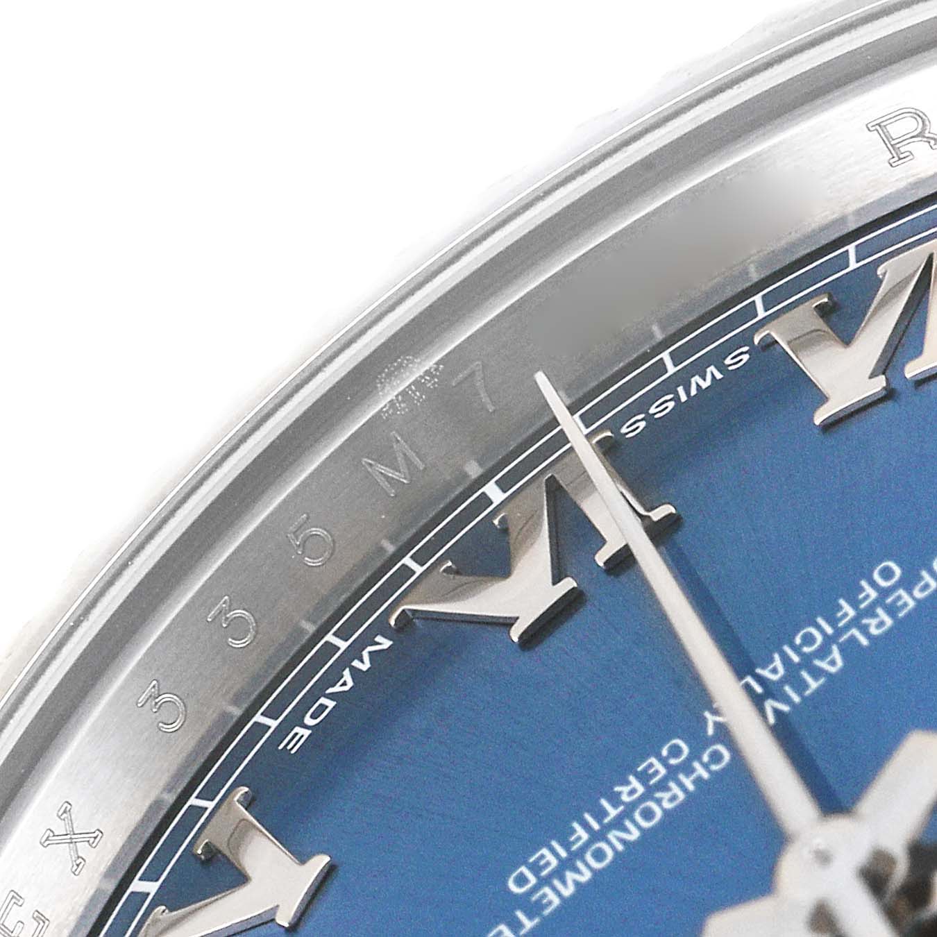 Close-up shot of the Rolex Datejust 41 116334 Men's Stainless Steel Blue Dial 116334 Men's Stainless Steel Blue Dial showing a portion of the blue dial, Roman numeral hour markers, and part of the bezel.