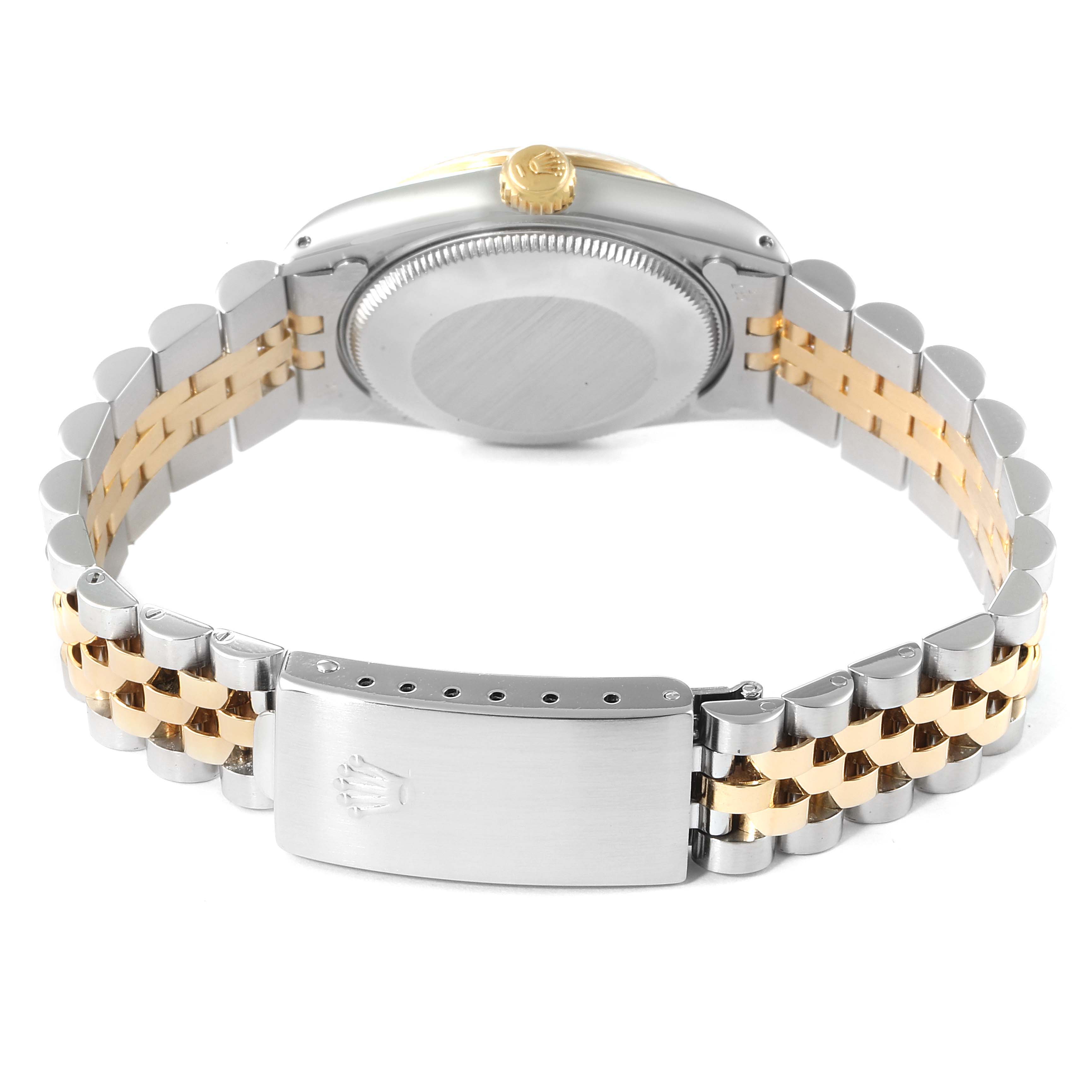 The image shows the back of the mid-size Rolex watch, featuring the clasp, bracelet, and case back.