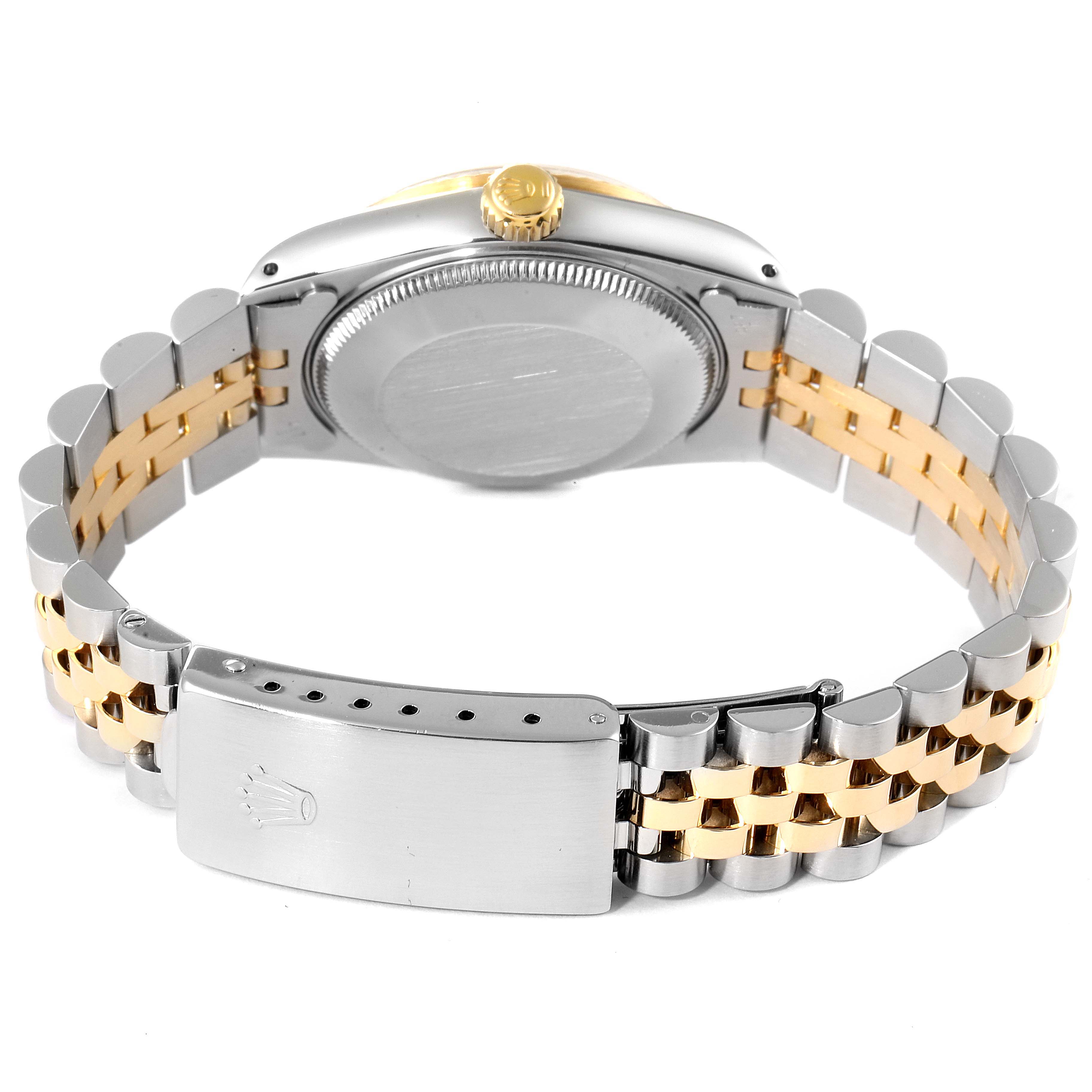 The image shows the back view of a Rolex Mid-Size 68273 Women's Steel and Gold (two tone) Beige Dial 68273 Women's Steel and Gold (two tone) Beige Dial model watch, highlighting the stainless steel and gold bracelet and clasp.