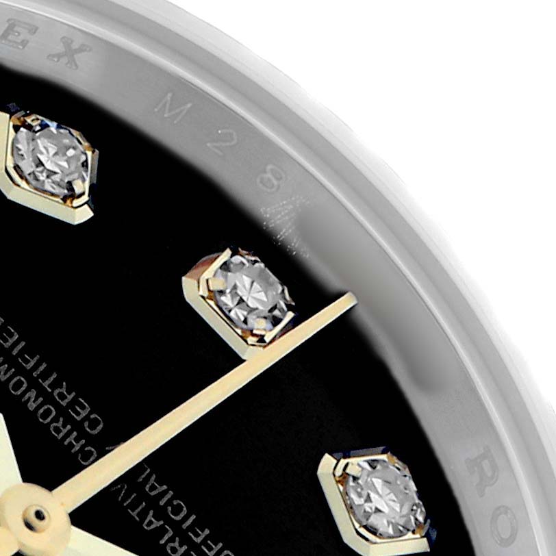 The image shows a close-up of the Rolex Datejust 179173 Women's Steel and Gold (two tone) Black Dial watch face, highlighting diamond hour markers and part of the hour hand.