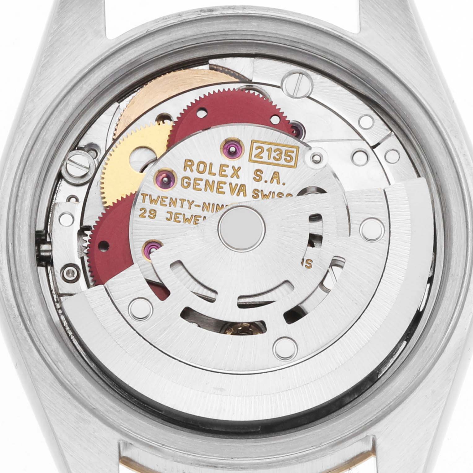 The image shows the Rolex Datejust 69173 Women
s Steel and Gold (two tone) Champagne Dial
s movement from the back, highlighting gears and inscriptions.