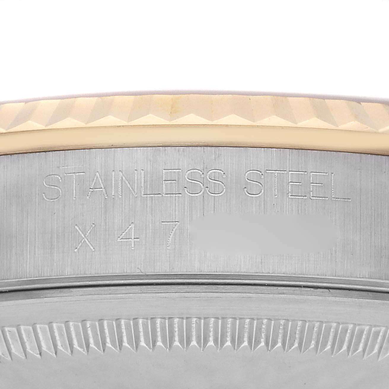The image shows a close-up of the back and side engraving of a Rolex Datejust 16233 Men's Steel and Gold (two tone) Champagne Dial 16233 Men's Steel and Gold (two tone) Champagne Dial, highlighting the stainless steel case.