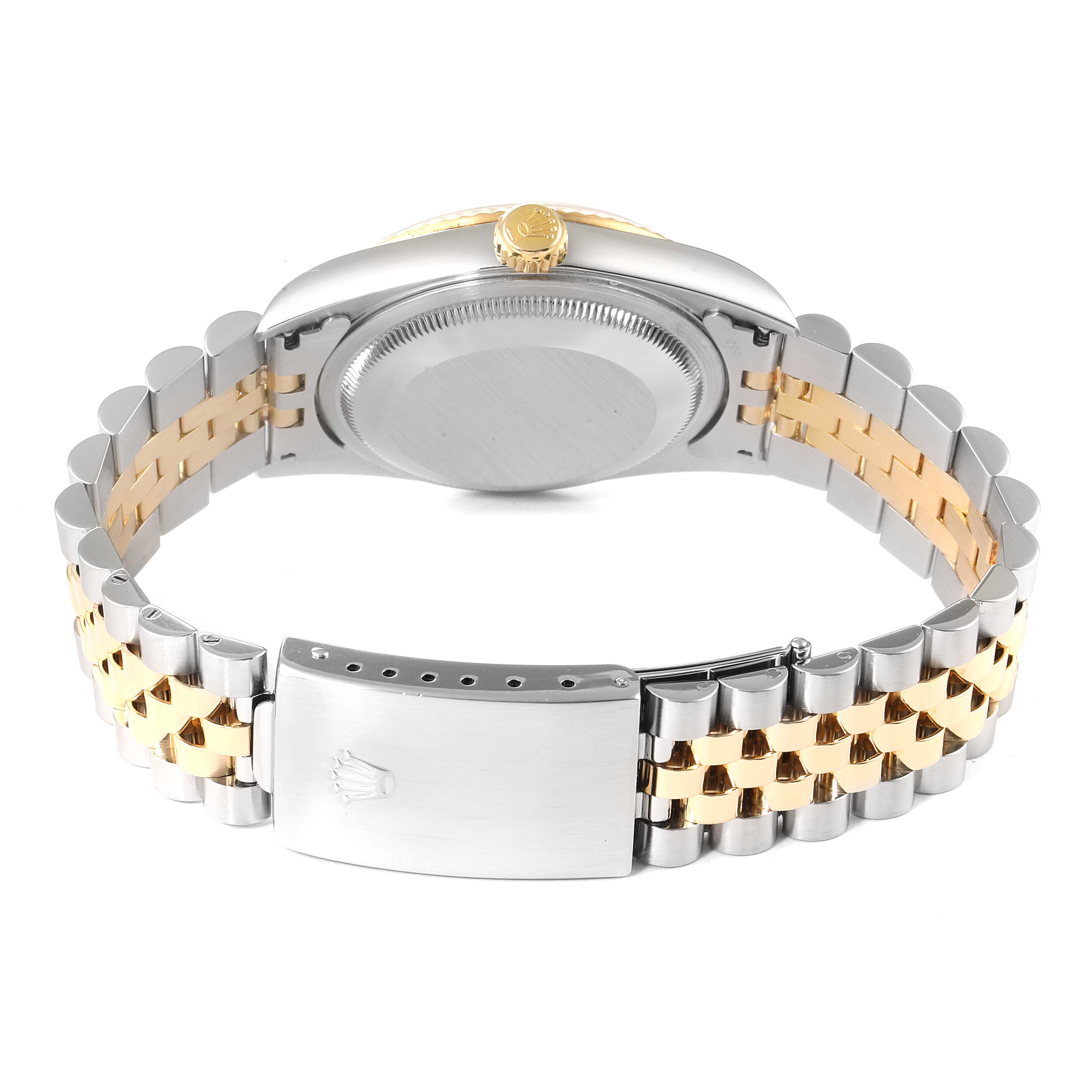 This image shows the backside and clasp of a Rolex Datejust 16233 Men's Steel and Gold (two tone) Black Dial 16233 Men's Steel and Gold (two tone) Black Dial watch, highlighting its two-tone bracelet and crown.