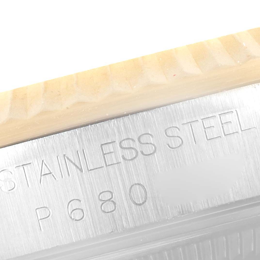 The image shows a close-up of the side of a Rolex Datejust 16233 Men's Steel and Gold (two tone) Black Dial 16233 Men's Steel and Gold (two tone) Black Dial watch, displaying the "STAINLESS STEEL" engraving.