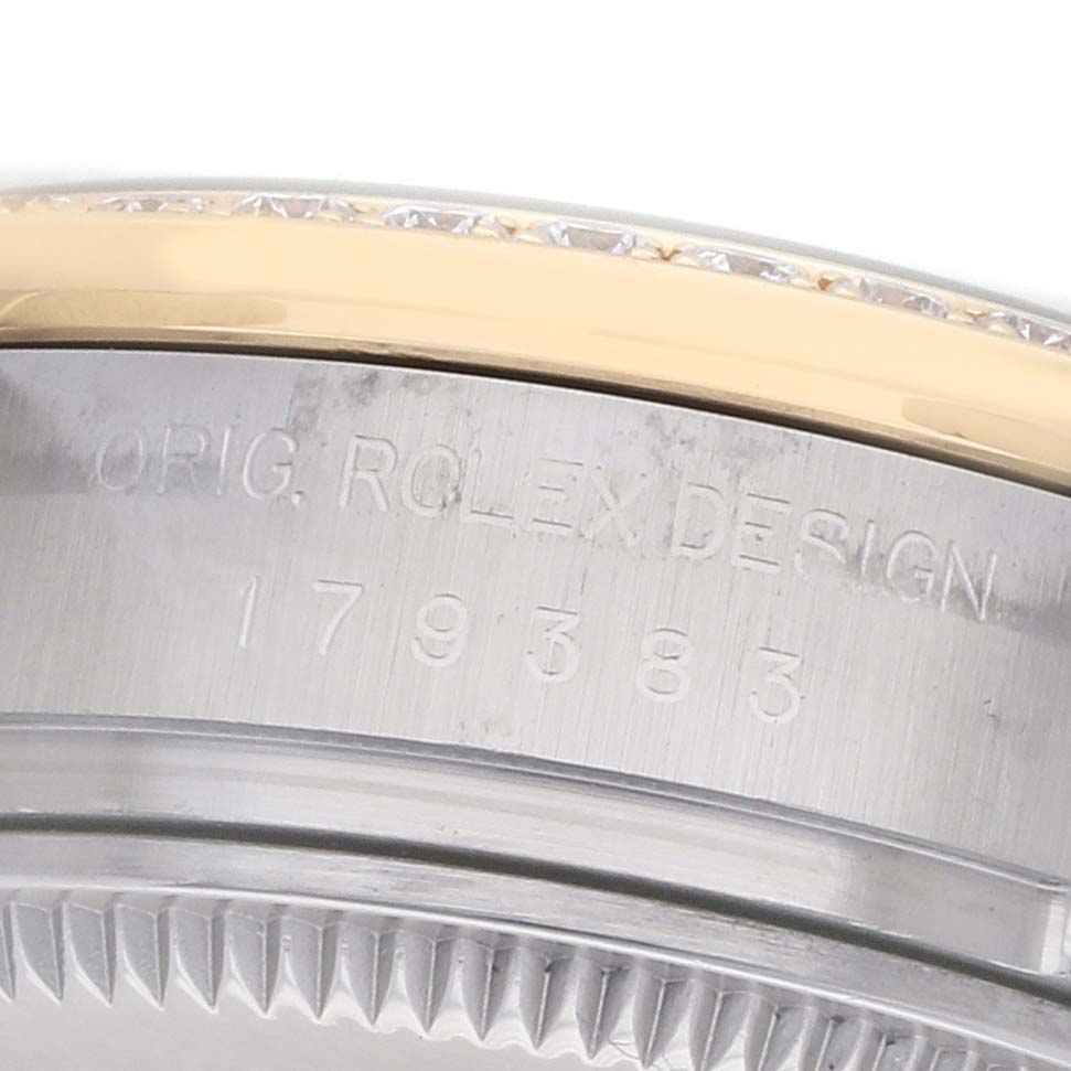 This image shows a close-up of the side of a Rolex Datejust 179383 Women
s Steel and Gold (two tone) Black Dial watch, highlighting the engraved model and bezel detail.