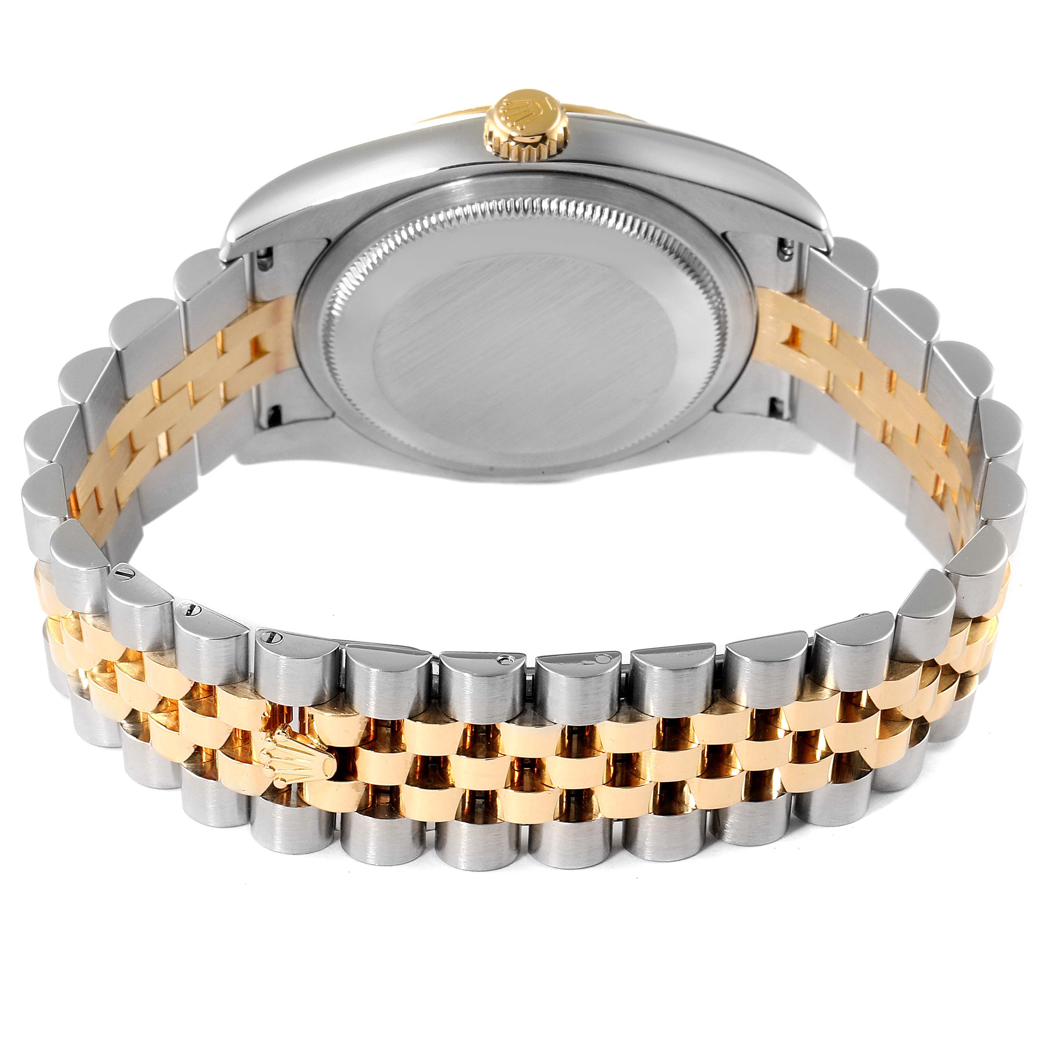The image shows the back view of a Rolex Datejust 116233 Men's Steel and Gold (two tone) Silver Dial 116233 Men's Steel and Gold (two tone) Silver Dial watch with a two-tone metal bracelet and visible crown.