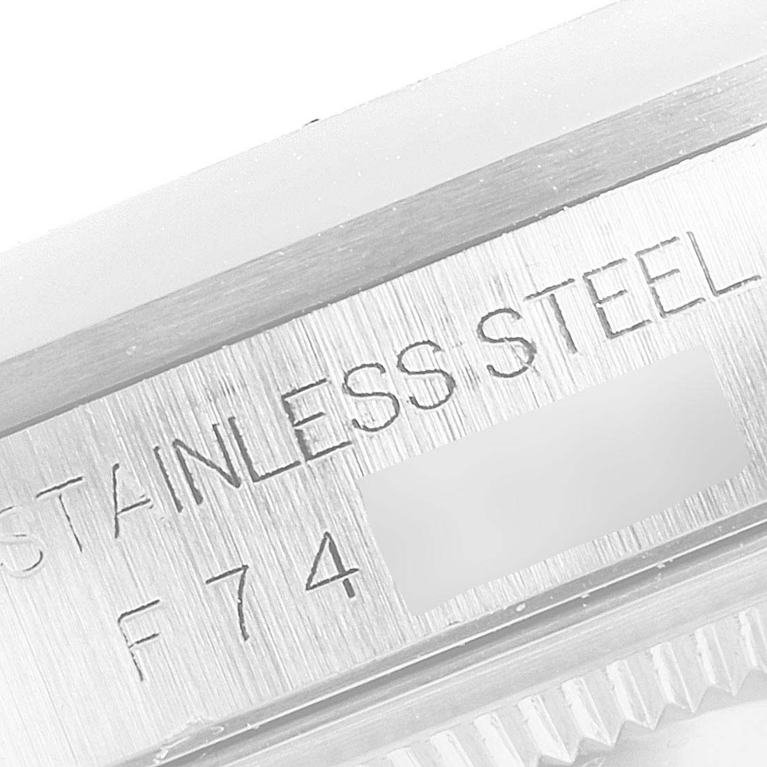 This close-up angle of the Rolex Datejust 16200 Men's Stainless Steel White Dial 16200 Men's Stainless Steel White Dial watch shows the "STAINLESS STEEL" engraving on the case.