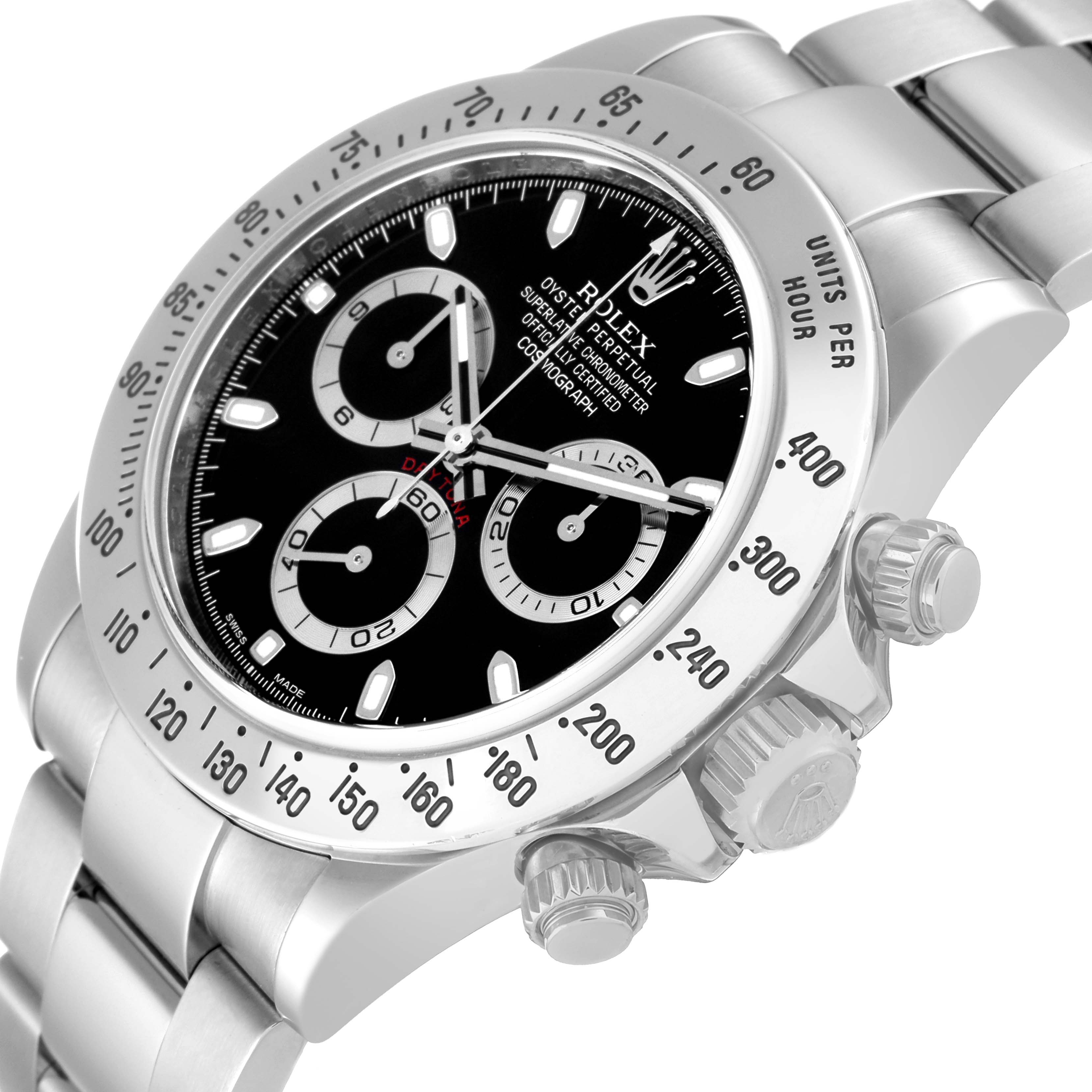 The image shows a close-up, angled view of a Rolex Daytona 116520 Men
s Stainless Steel Black Dial 116520 Men
s Stainless Steel Black Dial watch, highlighting the dial, bezel, and side crown.