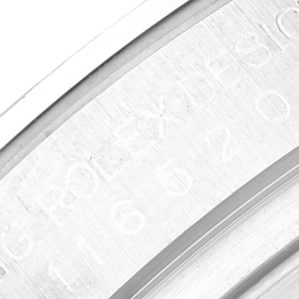 The image shows an extreme close-up of the engraved inner bezel of a Rolex Daytona 116520 Men
s Stainless Steel Black Dial 116520 Men
s Stainless Steel Black Dial watch.