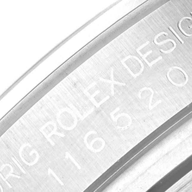 This close-up image shows the engraved inner bezel or rehaut of the Rolex Daytona 116520 Men's Stainless Steel White Dial 116520 Men's Stainless Steel White Dial watch model.