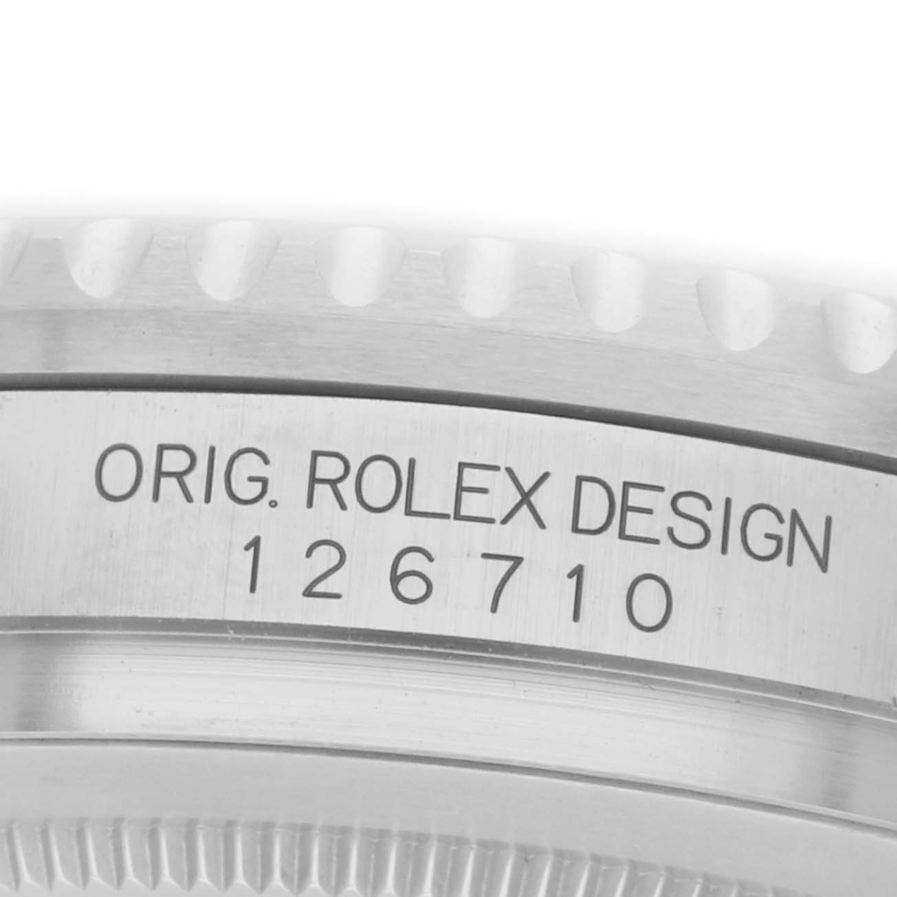 The image shows a close-up of the side of a Rolex GMT-Master 126710 Men
s Stainless Steel Black Dial watch, displaying the engraving "ORIG. ROLEX DESIGN 126710."