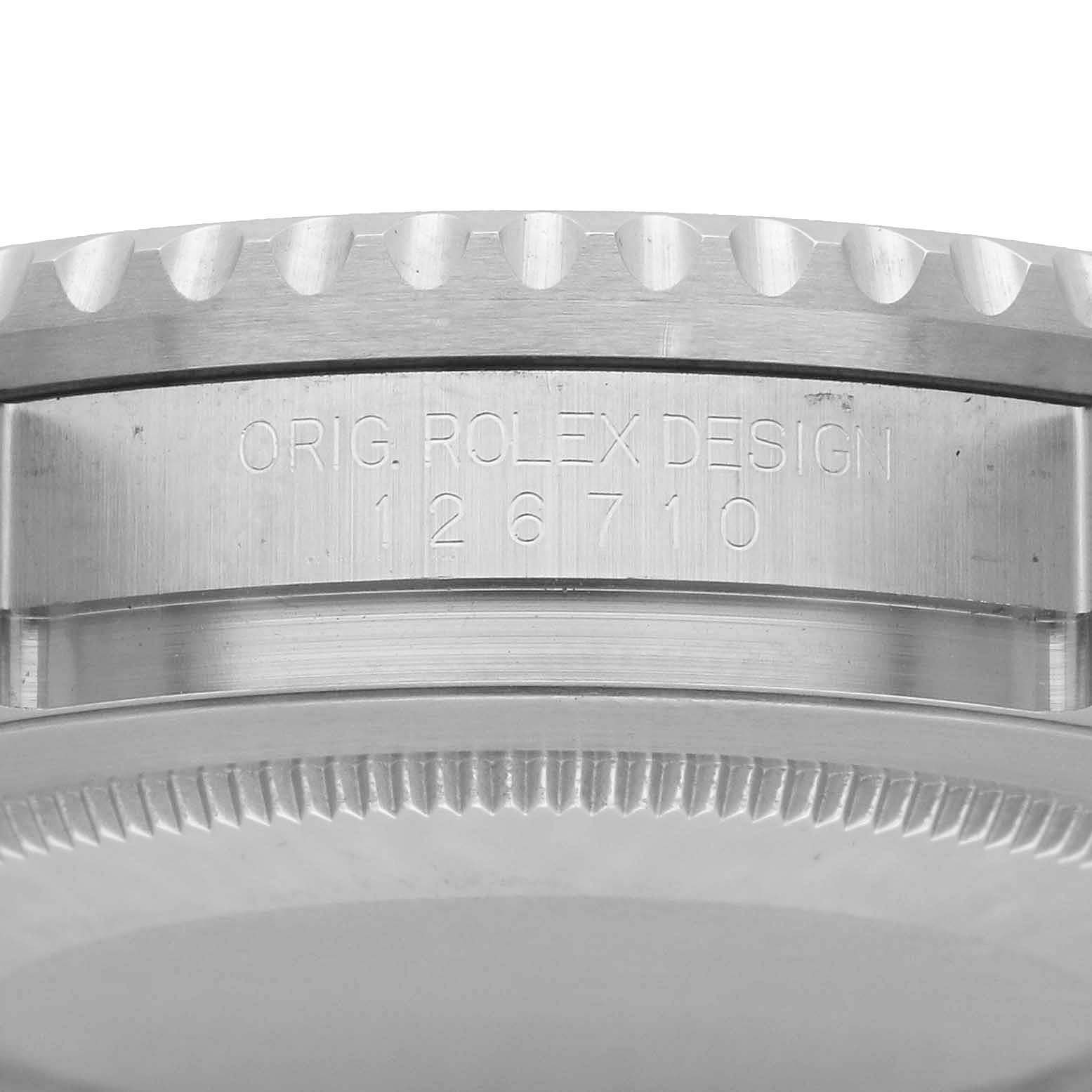 The image shows a close-up side view of the Rolex GMT-Master 126710 Men's Stainless Steel Black Dial's case, highlighting the bezel and engraved design code.