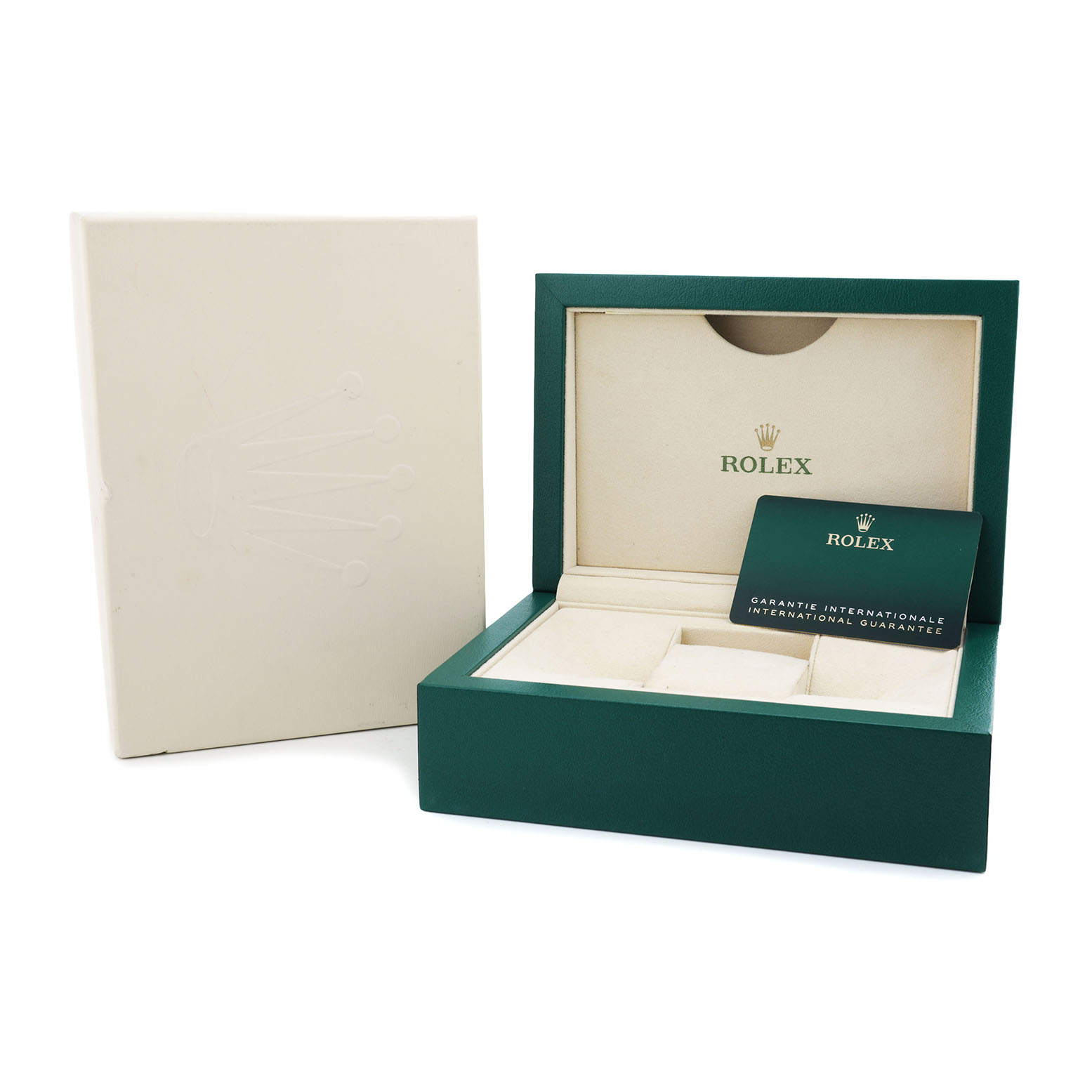 The image shows an open green Rolex Land-Dweller box with a guarantee card and outer packaging, viewed from the front.