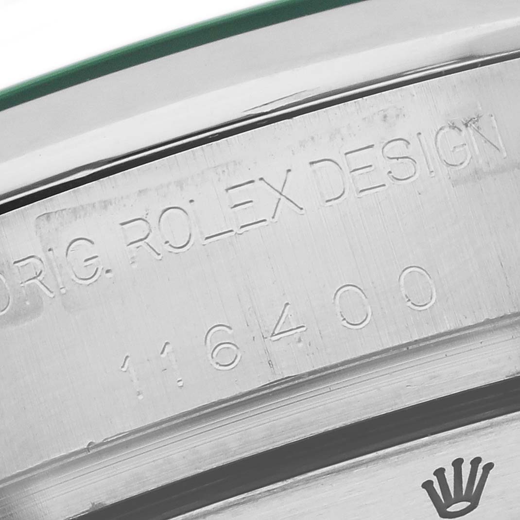 The image shows the side of the Rolex Milgauss 116400 Men's Stainless Steel Black Dial 116400 Men's Stainless Steel Black Dial watch case, highlighting engravings and part of the crown logo.
