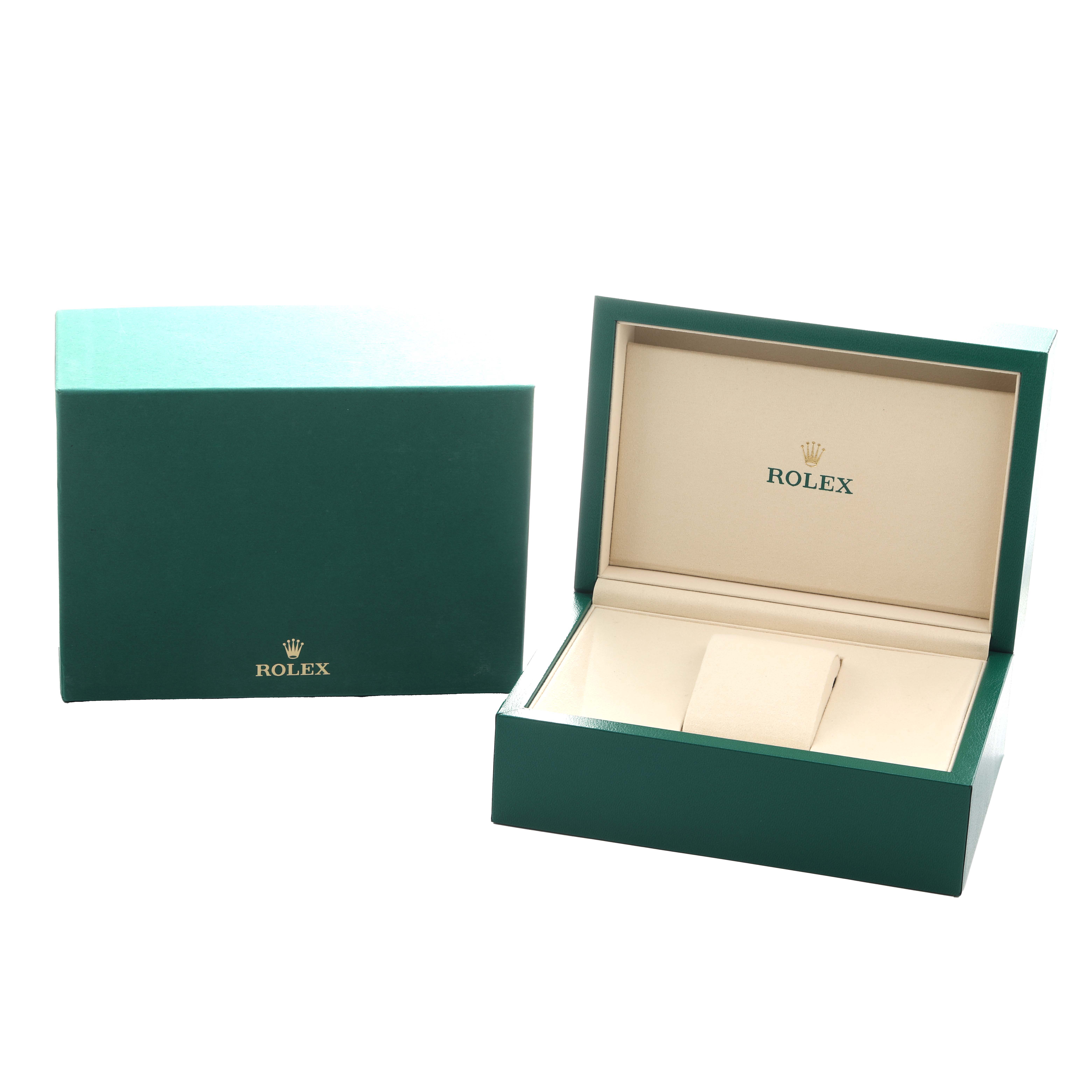 The image shows the open and closed green box for a Rolex Oyster Perpetual 124200 Men
s Stainless Steel Green Dial watch.