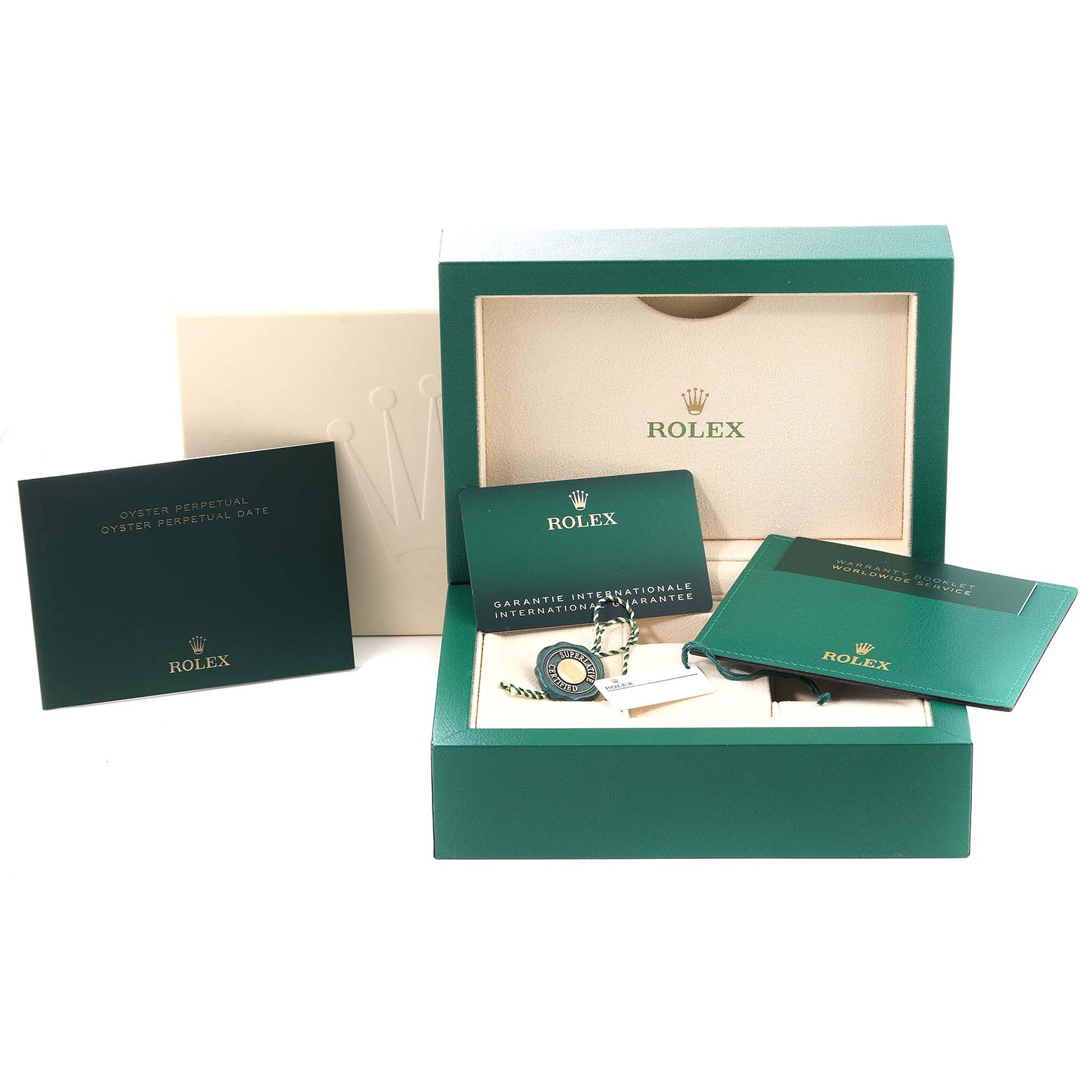 This image shows the accessories for the Rolex Oyster Perpetual 124300 Men
s Stainless Steel Black Dial 124300 Men
s Stainless Steel Black Dial, including a green box, booklets, a tag, and warranty cards.