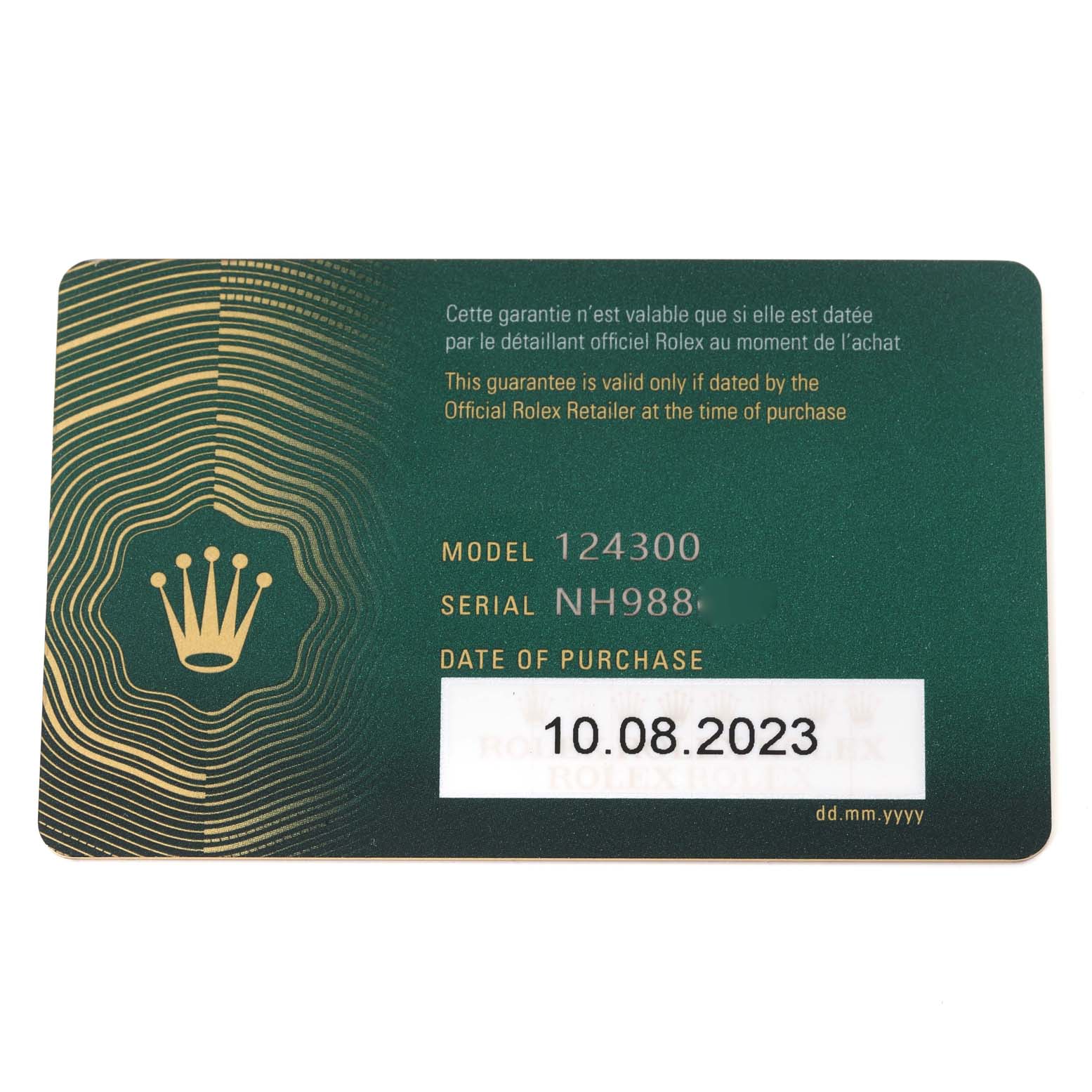 The image shows a warranty card for a Rolex Oyster Perpetual 124300 Men
s Stainless Steel Blue Dial 124300 Men
s Stainless Steel Blue Dial model 124300 with the purchase date.