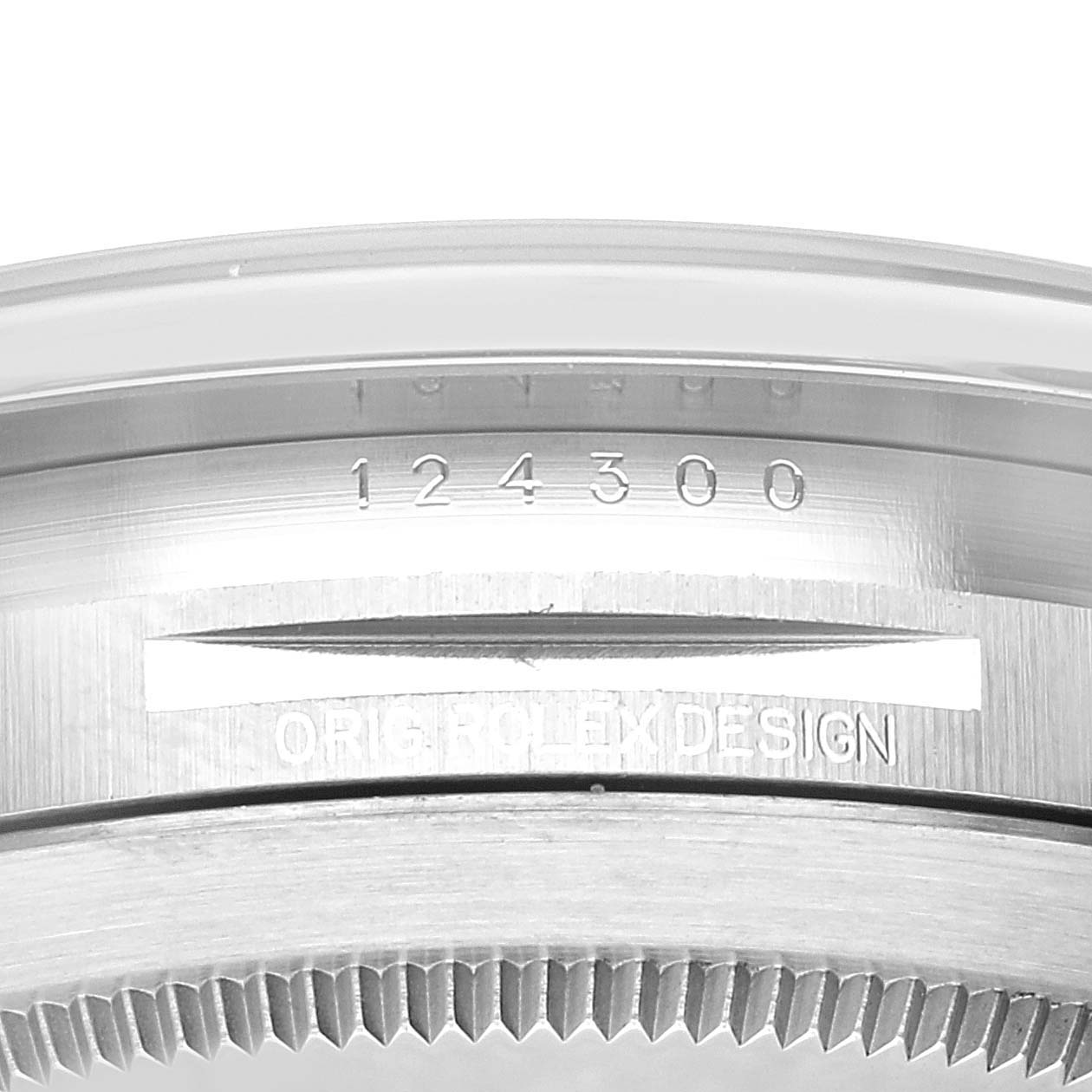 This image shows a close-up of the case back edge on a Rolex Oyster Perpetual 124300 Men
s Stainless Steel Blue Dial 124300 Men
s Stainless Steel Blue Dial model watch, displaying its reference number and the words "ORIGINAL ROLEX DESIGN."