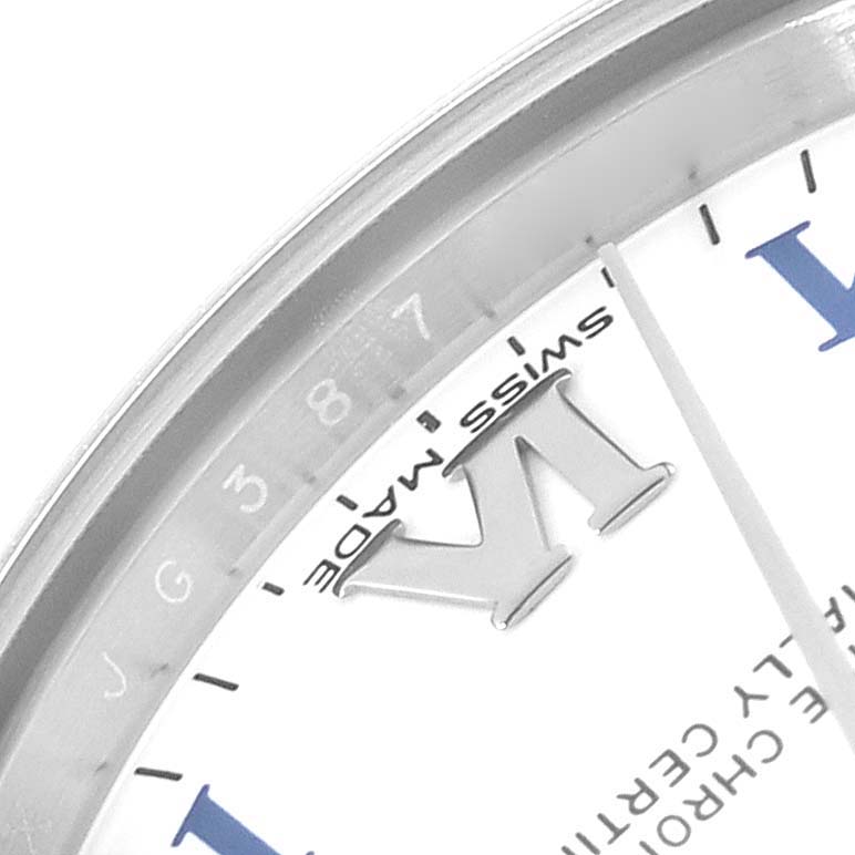 The image shows a close-up of the dial's edge and bezel of a Mid-Size Rolex watch, highlighting the "Swiss Made" marking.
