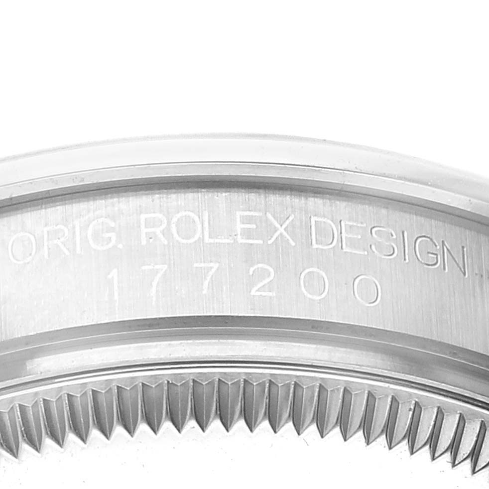 The image shows a close-up of the bezel and case side of a Rolex Mid-Size 177200 Women's Stainless Steel White Dial 177200 Women's Stainless Steel White Dial model with the engraving "ORIG. ROLEX DESIGN 177200."