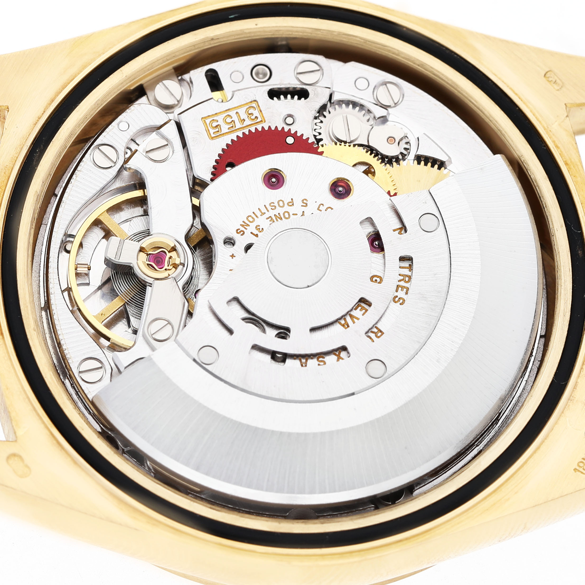 The image shows the movement of a Rolex President 18238 Men's Yellow Gold Champagne Dial watch from a rear angle, highlighting gears and inner mechanical components.