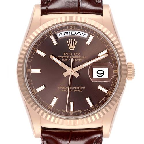 The Rolex President model watch is shown from a frontal angle, displaying the face, bezel, crown, and part of the leather strap.