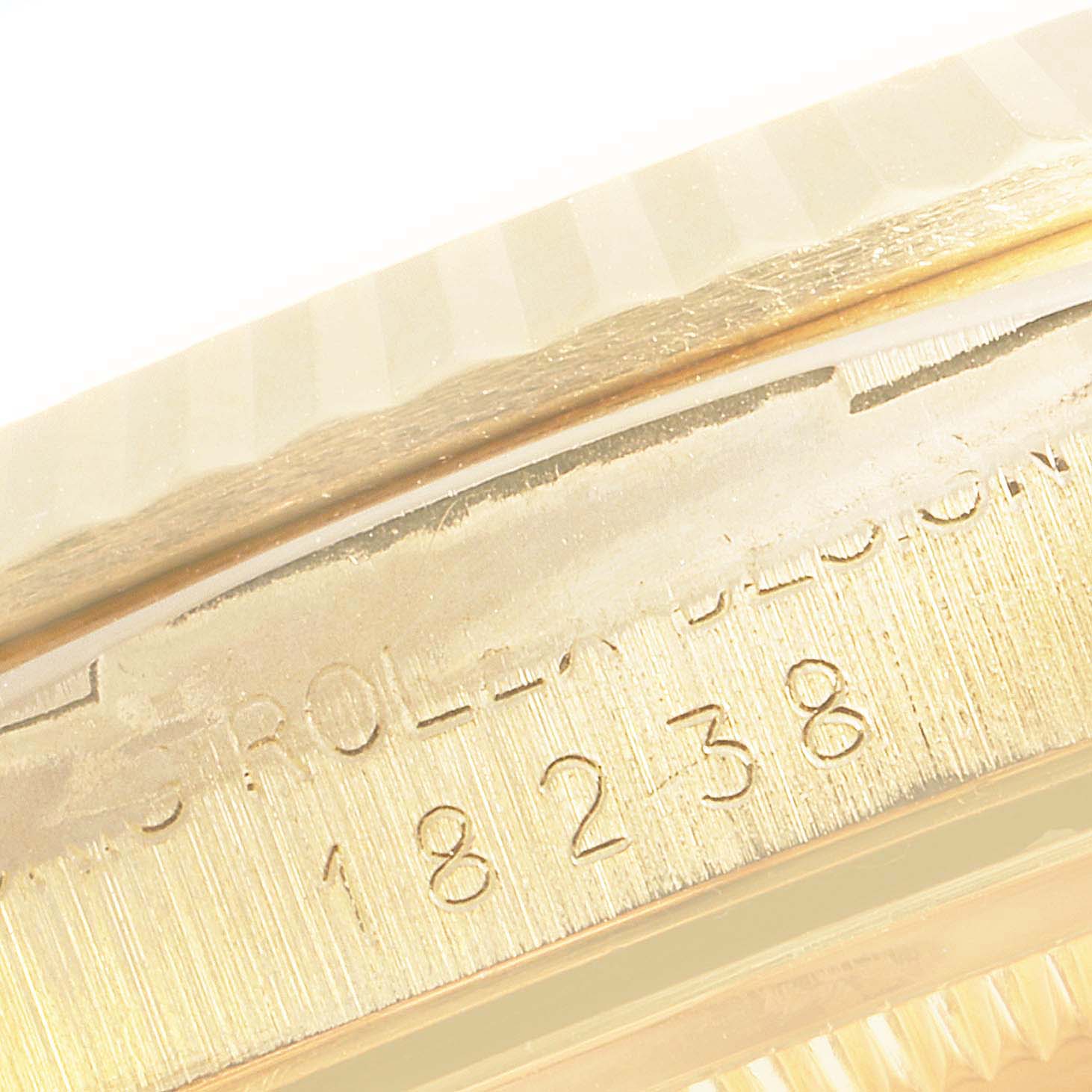 This image shows the edge and serial number engraving on the Rolex President 18238 Men's Yellow Gold Champagne Dial 18238 Men's Yellow Gold Champagne Dial model watch.