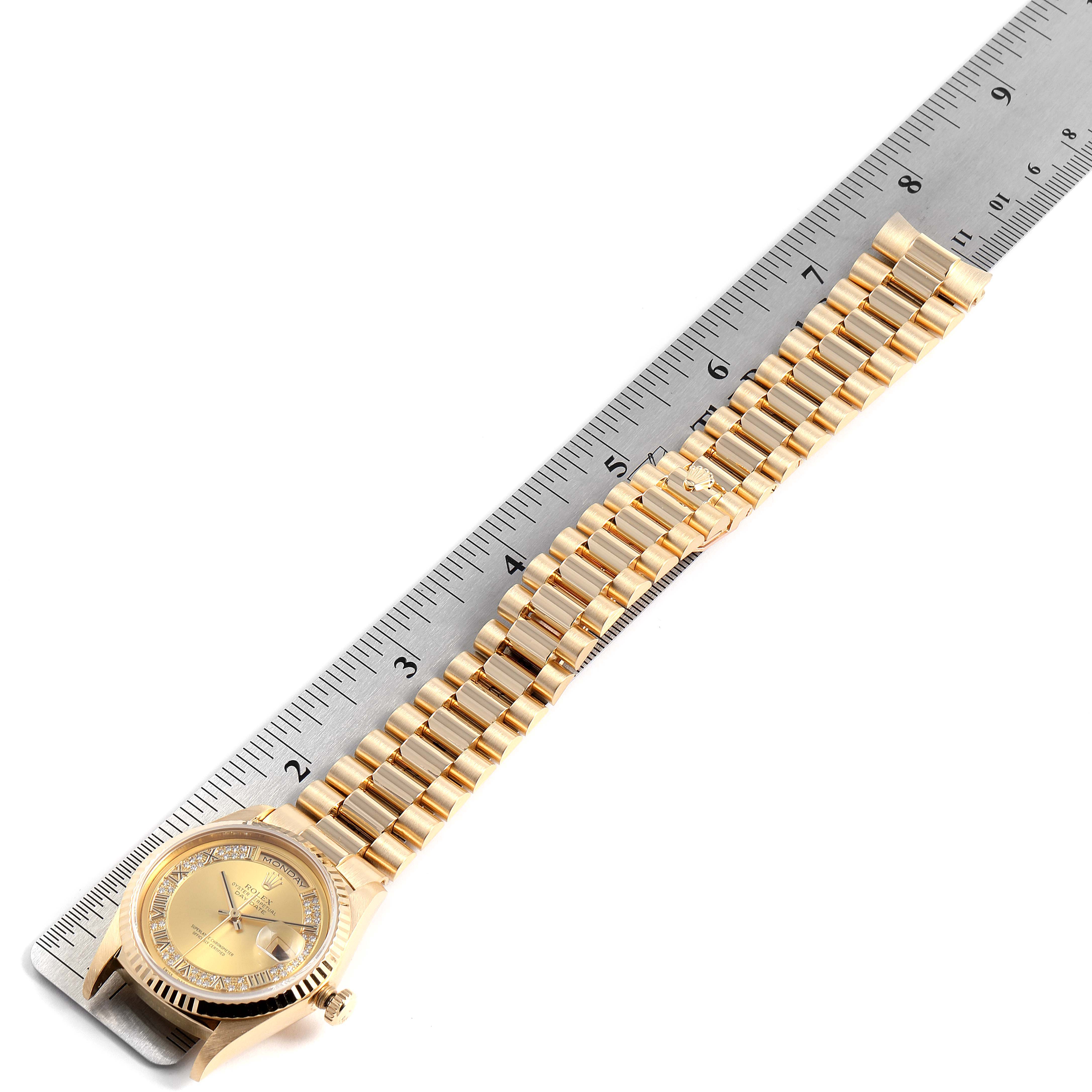 The image shows a gold Rolex President 18238 Men's Yellow Gold Champagne Dial 18238 Men's Yellow Gold Champagne Dial model watch lying flat, with a ruler beside it to measure the length of the band.