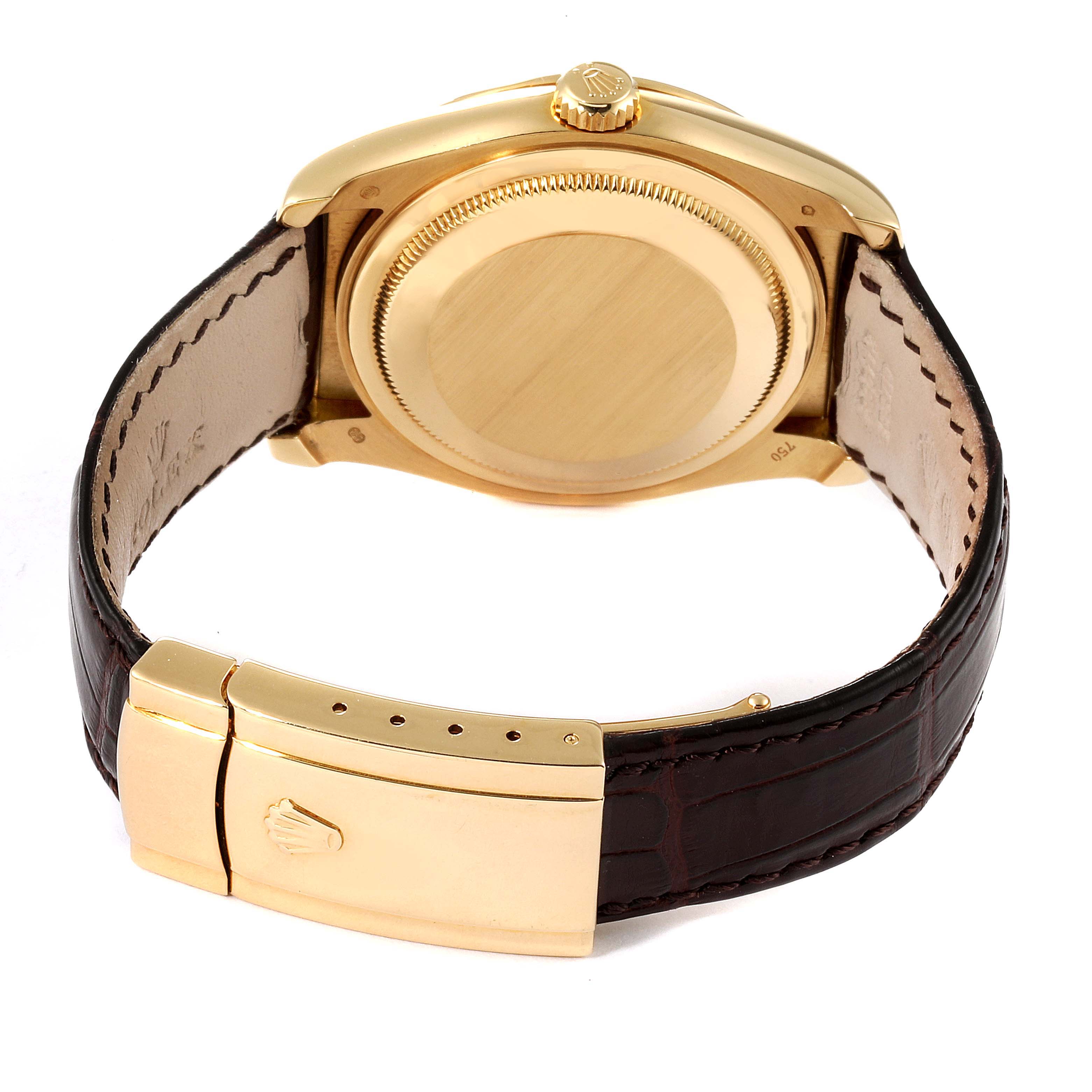 This image shows the case back, crown, and leather strap with clasp of a Rolex Datejust 116188 Men's Yellow Gold Mother of Pearl Dial 116188 Men's Yellow Gold Mother of Pearl Dial watch from a rear angle.