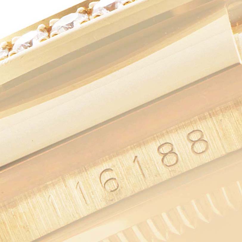 This image shows a close-up of the model number engraving and diamond bezel of a Rolex Datejust 116188 Men's Yellow Gold Mother of Pearl Dial 116188 Men's Yellow Gold Mother of Pearl Dial watch.