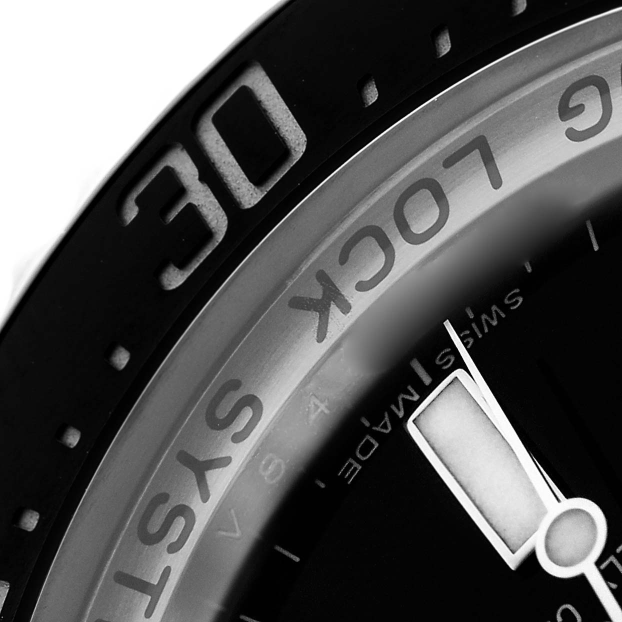 The image shows a close-up of the Rolex Sea-Dweller 116660 Men
s Stainless Steel Black Dial watch focusing on the bezel and part of the dial.