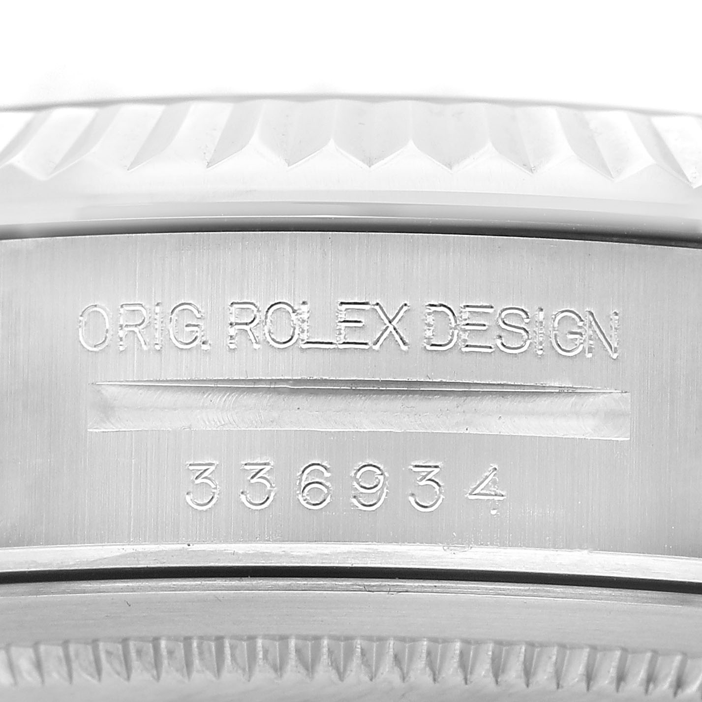 The image shows a close-up of the edge and side of the Rolex Sky-Dweller 336934 Men's Stainless Steel Green Dial, featuring the model number and "ORIG ROLEX DESIGN."