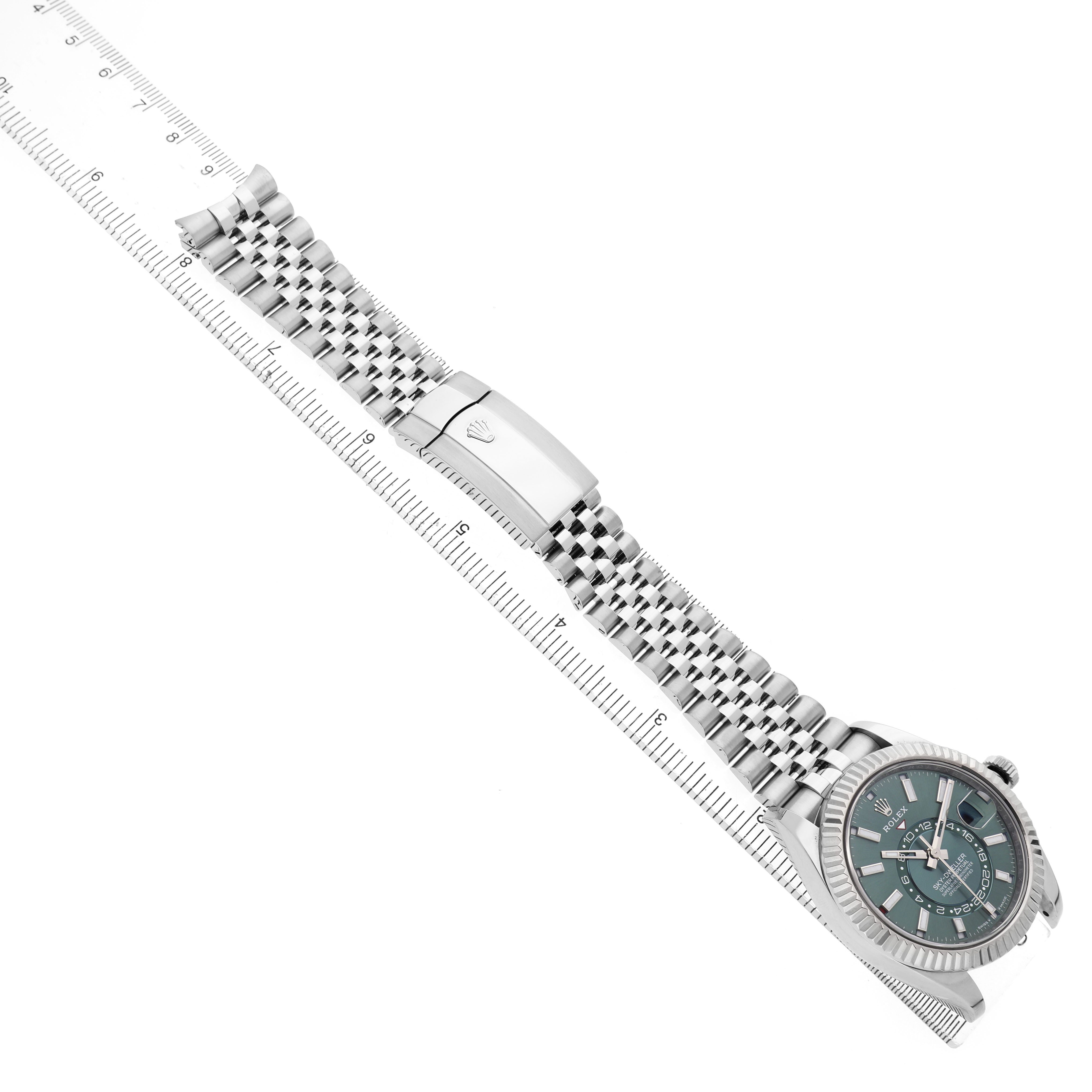 The Rolex Sky-Dweller 336934 Men's Stainless Steel Green Dial watch is shown from an angled top view, highlighting the face, bezel, bracelet, and clasp.