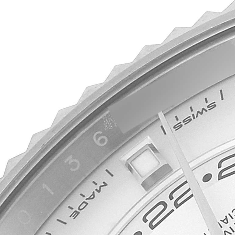 The image shows a close-up view of the Rolex Sky-Dweller 326934 Men
s Stainless Steel White Dial 326934 Men
s Stainless Steel White Dial
s bezel and part of the dial, including the date and markers.