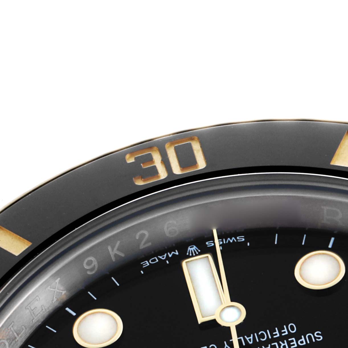 The image shows a close-up of the black bezel and dial of a Rolex Submariner 126613 Men's Steel and Gold (two tone) Black Dial, highlighting the "30" minute marking.