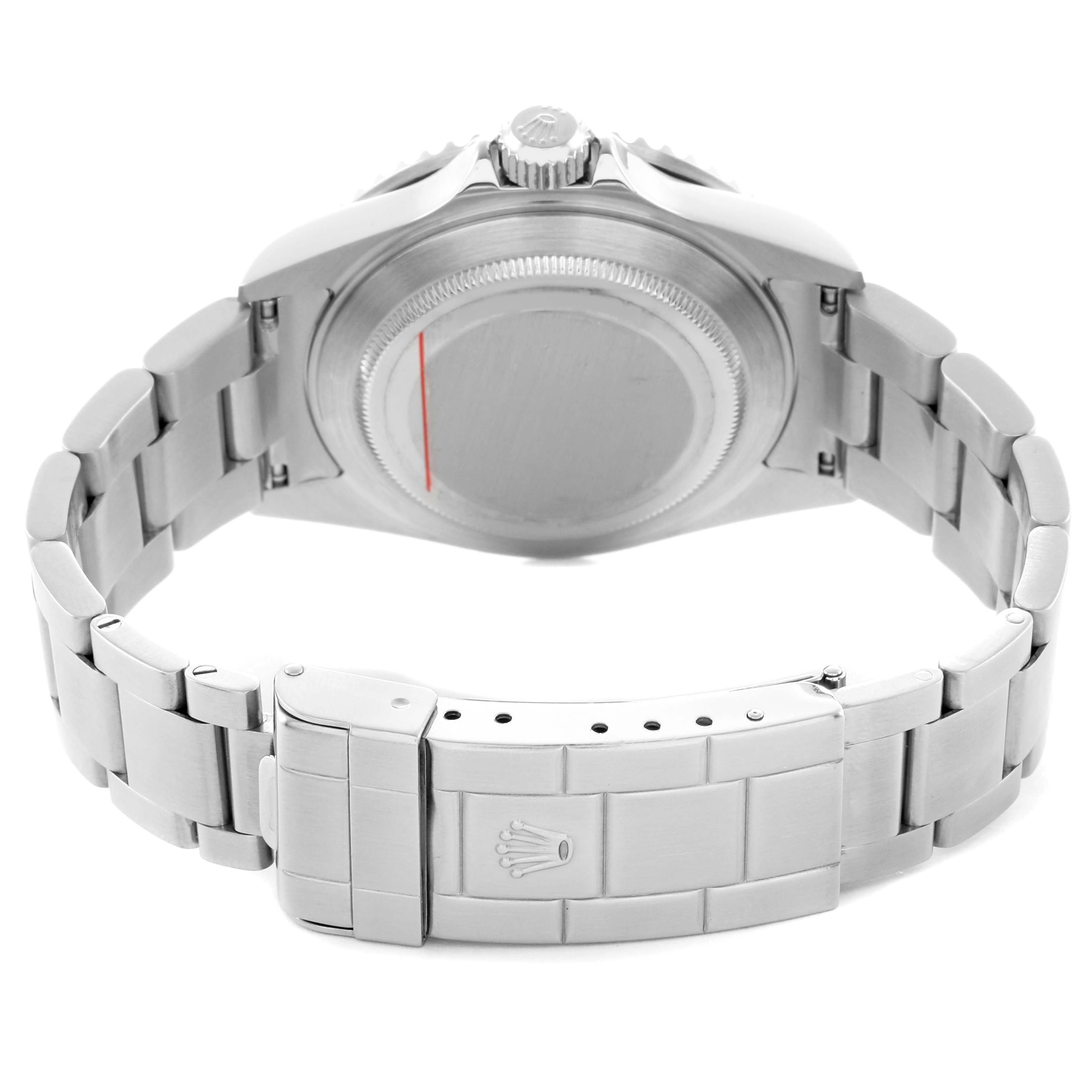 The image shows the backside of a Rolex Submariner 16610 Men
s Stainless Steel Black Dial, highlighting the case back, bracelet, and clasp.