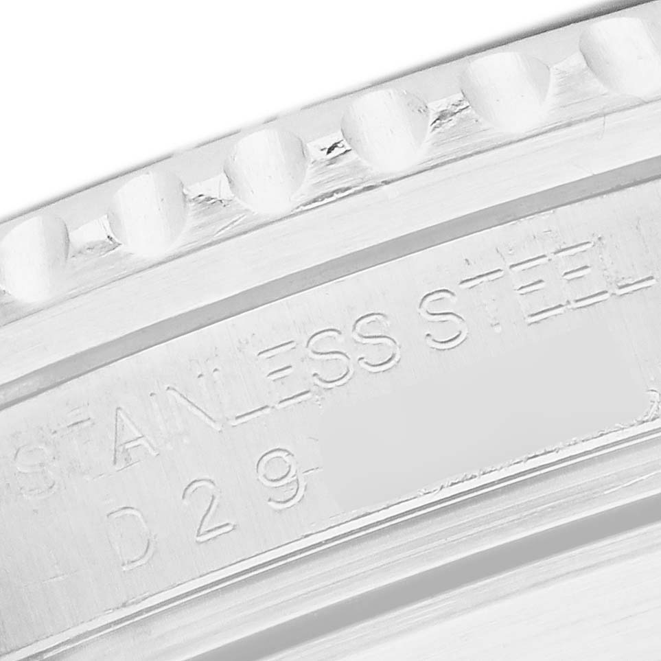 The image shows a close-up of a stainless steel case back or bezel edge with engravings for a Rolex Submariner 16610 Men
s Stainless Steel Black Dial.