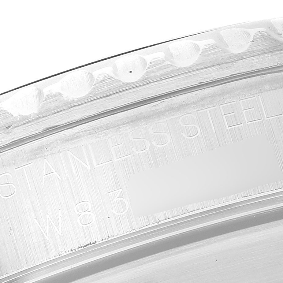 The image shows a close-up of the bezel and engraved text on the side of a Rolex Submariner 14060 Men's Stainless Steel Black Dial watch.
