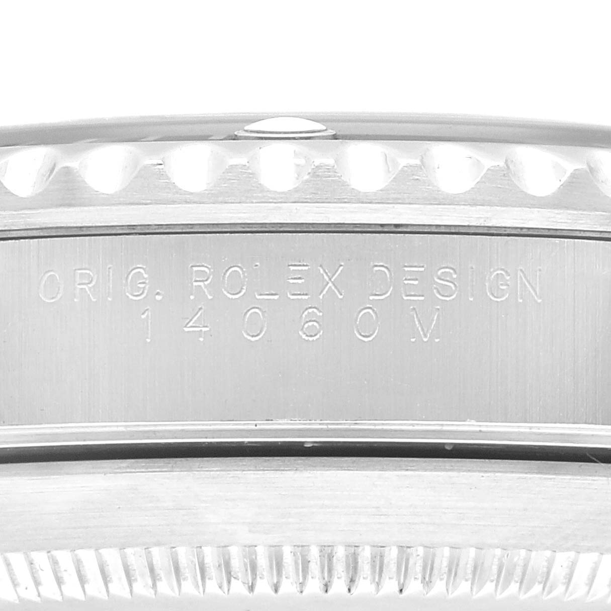 This image shows a close-up of the side engraving on a Rolex Submariner 14060 Men
s Stainless Steel Black Dial 14060 Men
s Stainless Steel Black Dial model, including the model and design number.