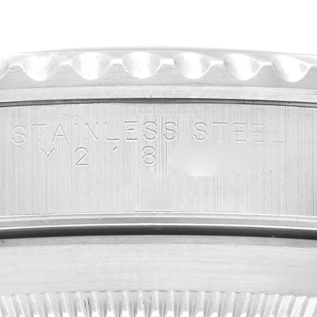 The image displays a close-up of the case back engraving on a Rolex Submariner 14060 Men
s Stainless Steel Black Dial 14060 Men
s Stainless Steel Black Dial watch, highlighting "STAINLESS STEEL" and the serial number.