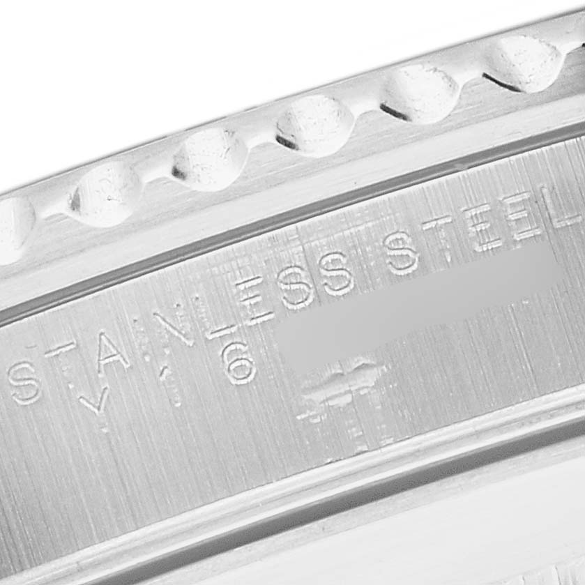 This close-up image shows a portion of the bezel and the engraved inner ring of a Rolex Submariner 14060 Men
s Stainless Steel Black Dial 14060 Men
s Stainless Steel Black Dial watch.