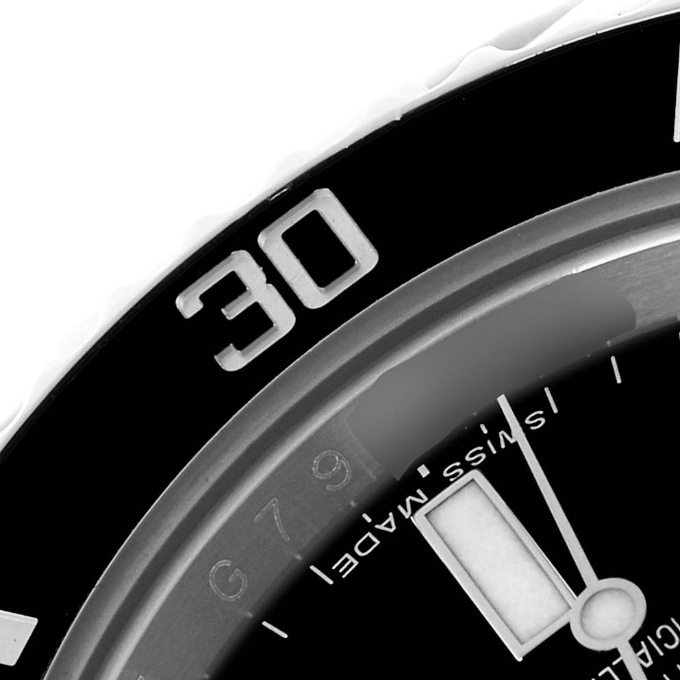 The image shows a close-up of the bezel and part of the dial of a Rolex Submariner 114060LN Men
s Stainless Steel Black Dial 114060LN Men
s Stainless Steel Black Dial, prominently displaying the "30" marking.