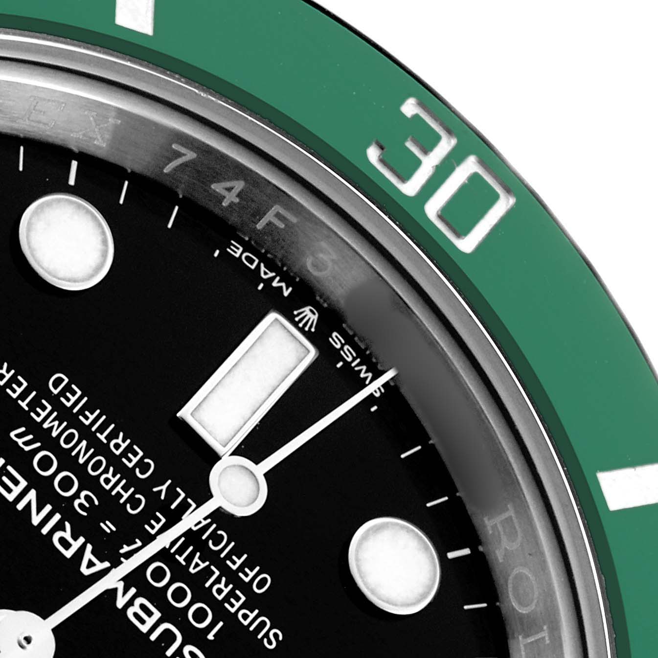 The image shows a close-up of the Rolex Submariner 126610 Men
s Stainless Steel Black Dial
s bezel and partial dial, highlighting the green bezel and white markers.