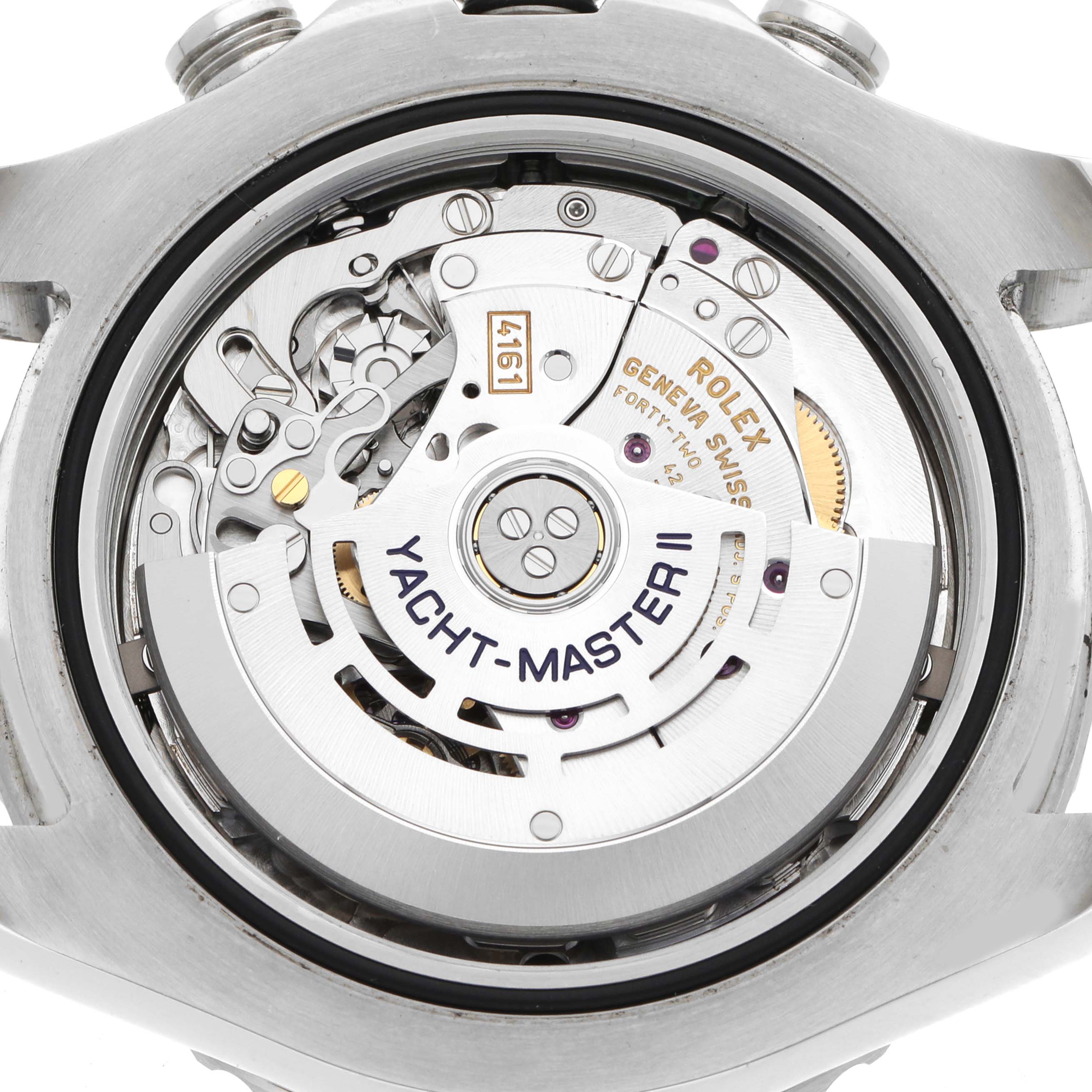 The image shows the Rolex Yacht-Master 116680 Men
s Stainless Steel White Dial II
s movement from a top-down angle, highlighting its intricate mechanism and rotor.