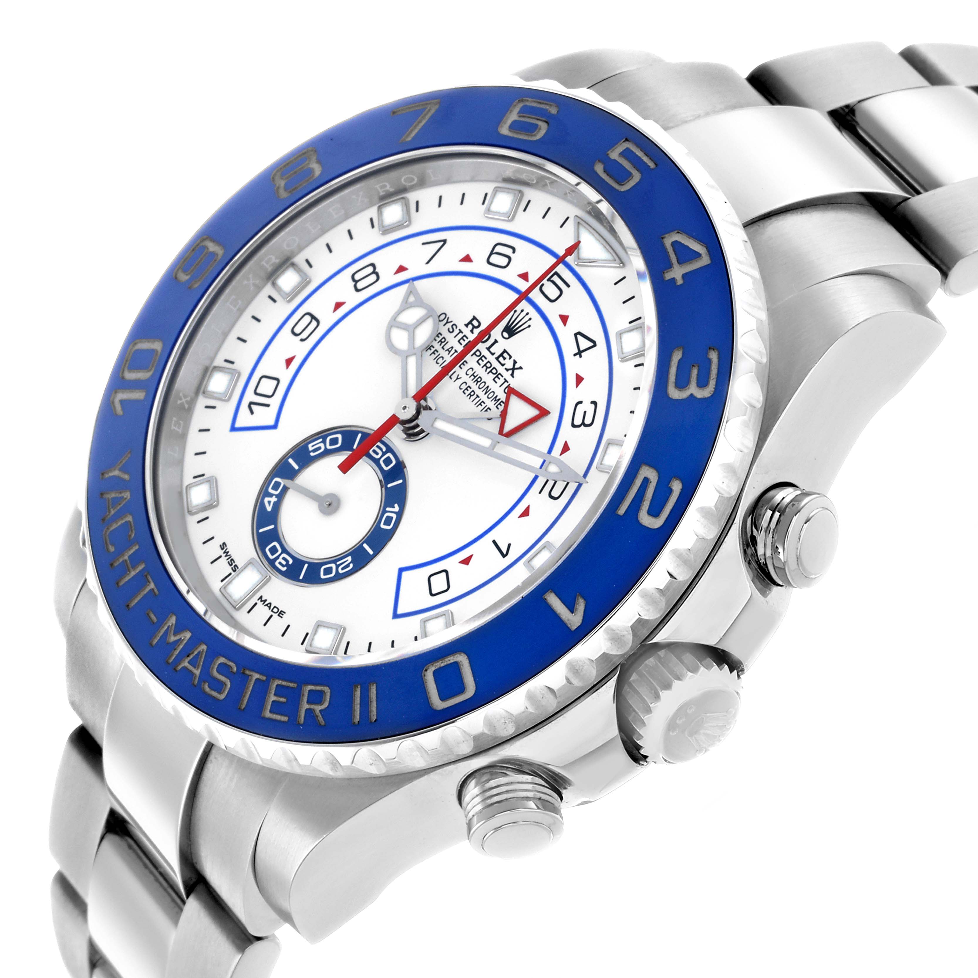 The Rolex Yacht-Master 116680 Men
s Stainless Steel White Dial II watch is shown at an angle, displaying its blue bezel, dial, crown, and part of the bracelet.