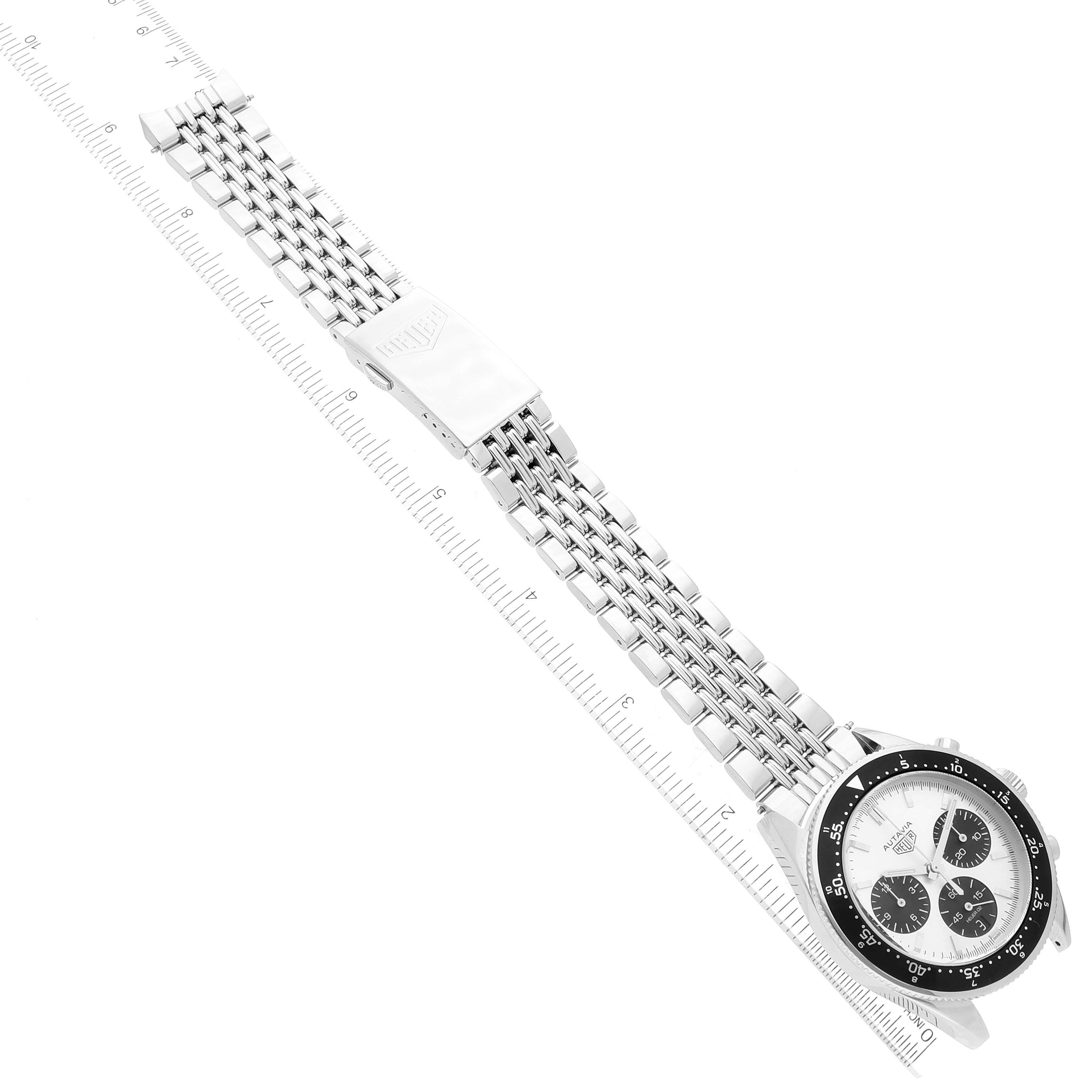 The image shows a top-down view of the Tag Heuer Limited Edition watch, highlighting its stainless steel band, clasp, and face.