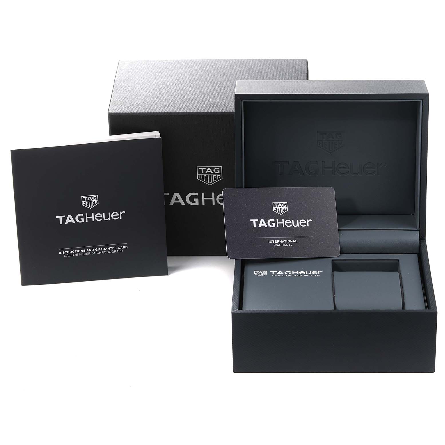 The image shows the packaging, instruction manual, and warranty card for the Tag Heuer Carrera CAR2A1H.FT6101 Men's Stainless Steel Black Dial CAR2A1H.FT6101 Men's Stainless Steel Black Dial watch.