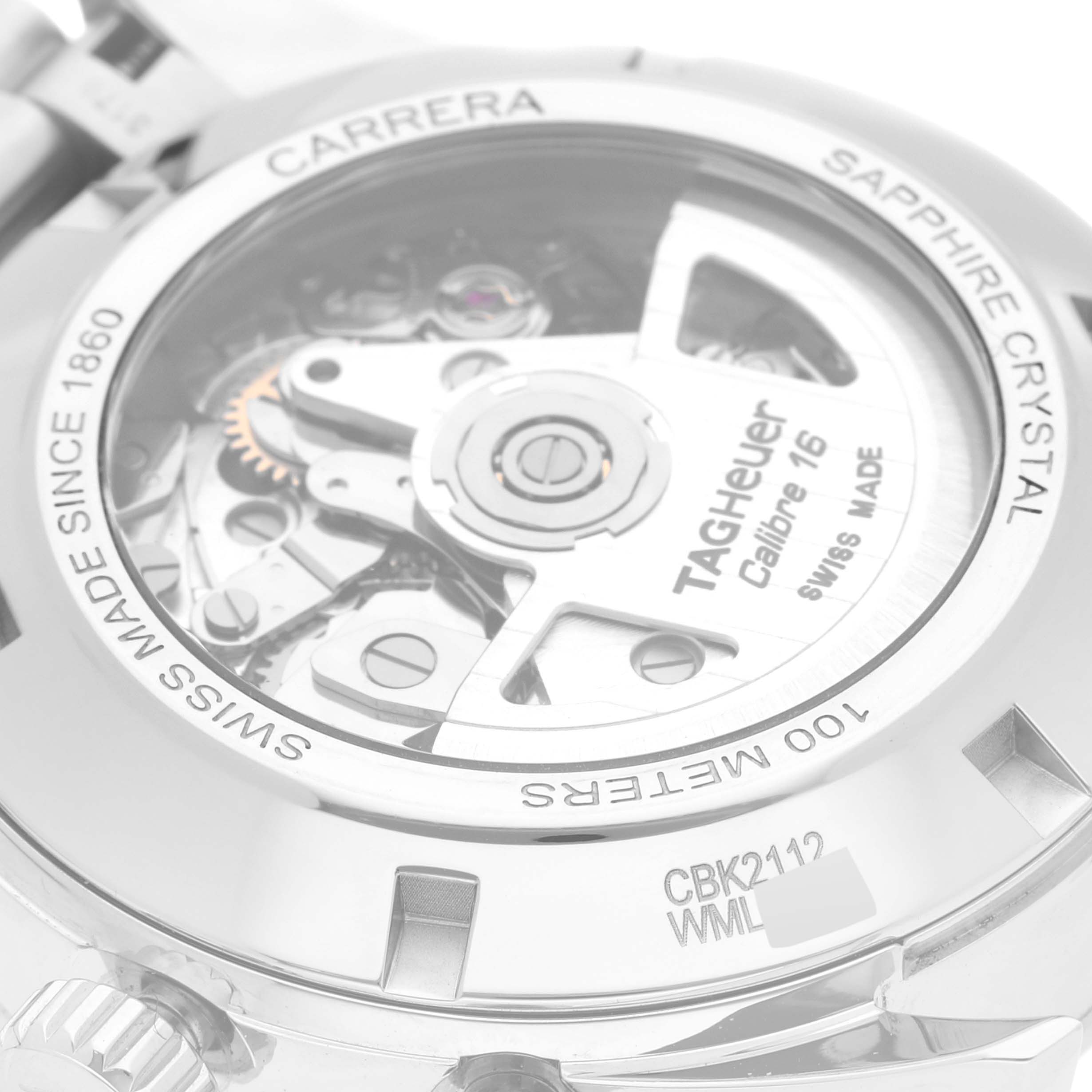 The image shows the back view of a Tag Heuer Carrera CBK2112.BA0715 Men's Stainless Steel Blue Dial CBK2112.BA0715 Men's Stainless Steel Blue Dial watch, highlighting the movement and the inscriptions on the case back.