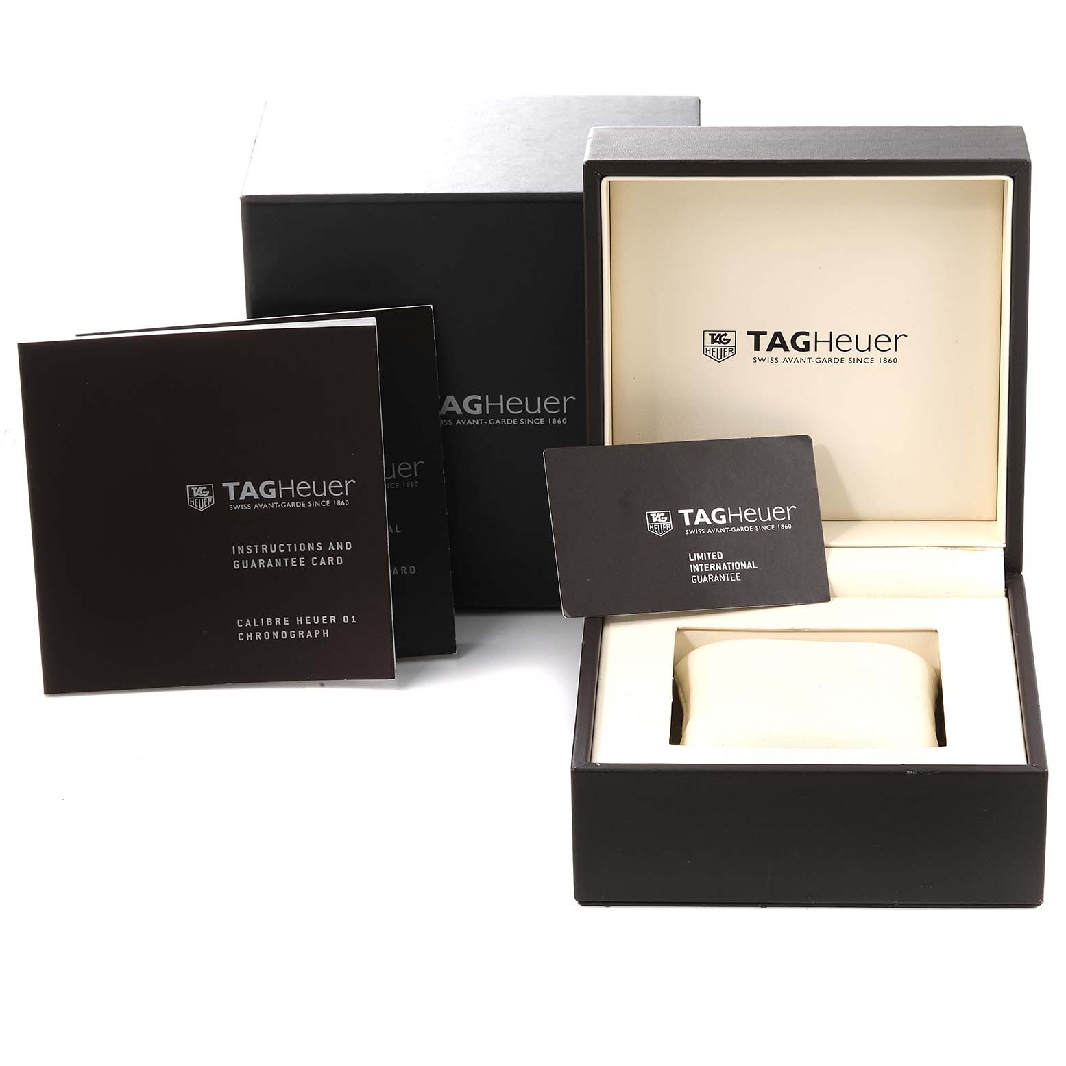 The image shows the packaging, instruction manual, guarantee card, and box for the Tag Heuer Carrera CAR2A1W.BA0703 Men's Stainless Steel Black Dial CAR2A1W.BA0703 Men's Stainless Steel Black Dial watch model.